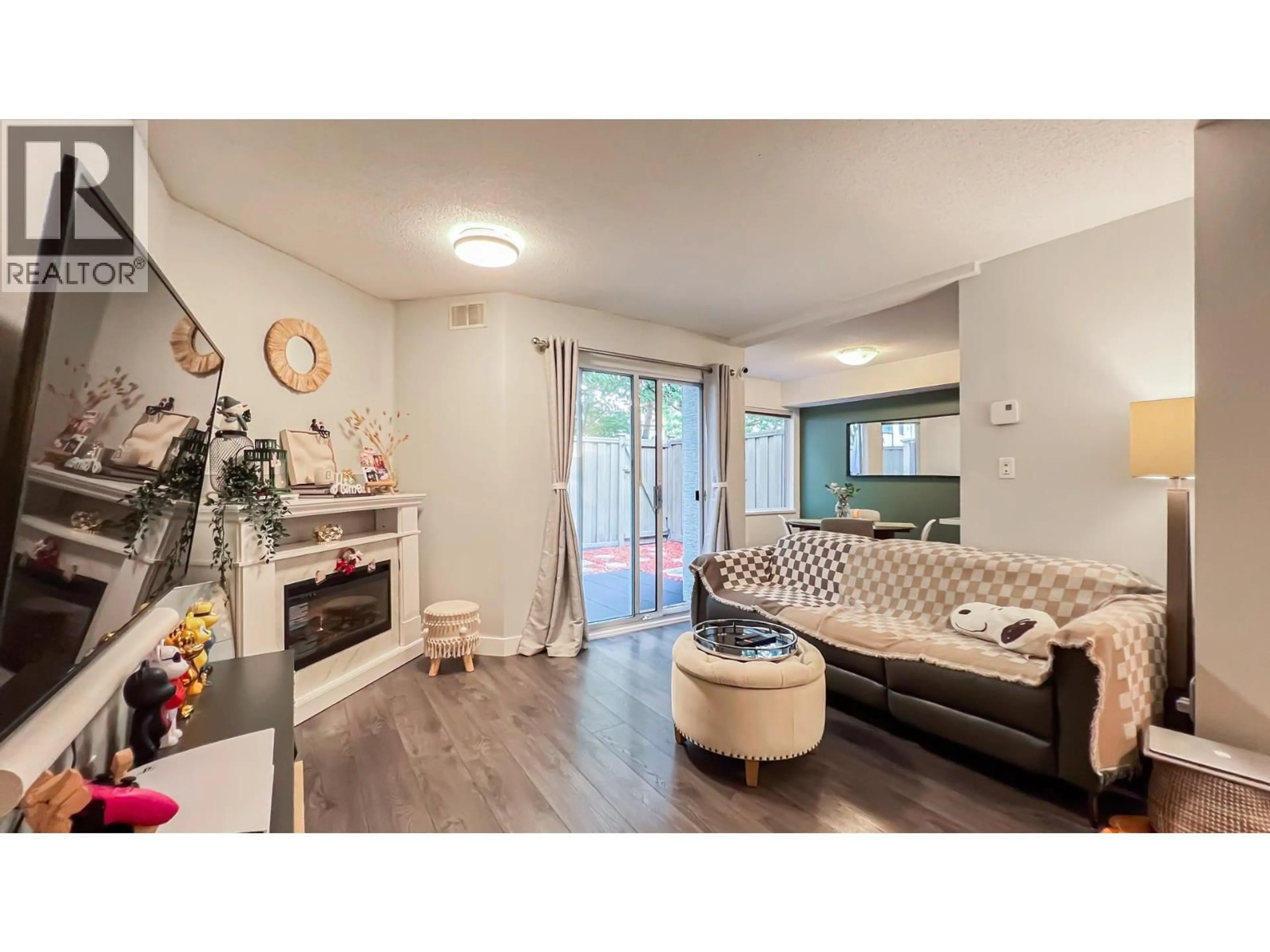 Living room with furniture, wood/laminate floor for 15 - 12020 GREENLAND DRIVE, Richmond British Columbia V6V2M8