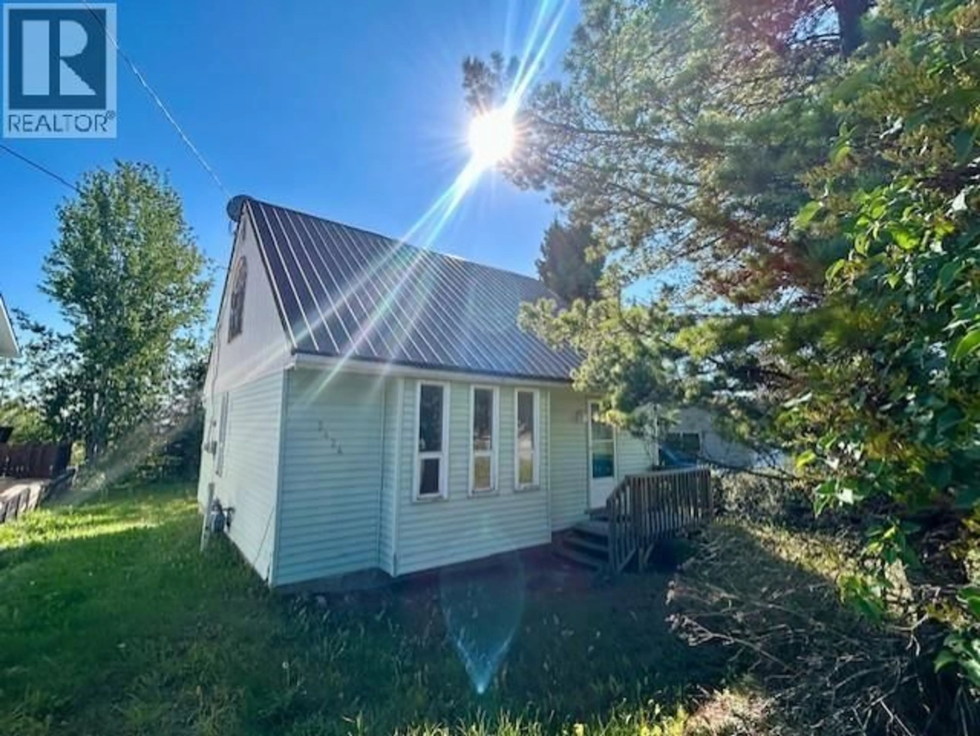 A pic from outside/outdoor area/front of a property/back of a property/a pic from drone, building for 5424 52 STREET, Fort Nelson British Columbia V0C1R0
