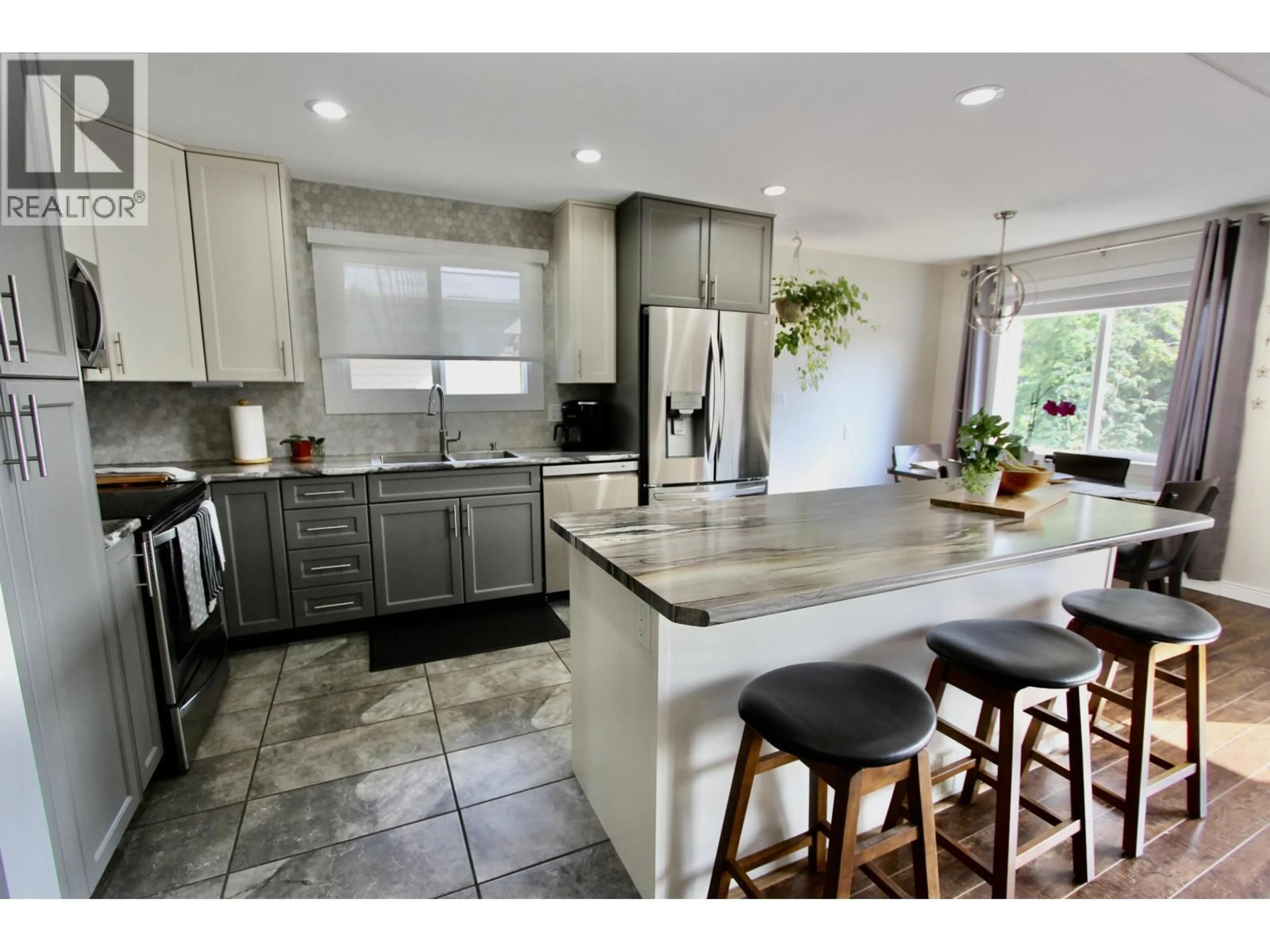 Open concept kitchen, ceramic/tile floor for 4252 PUNCHAW CRESCENT, Prince George British Columbia V2M5E9
