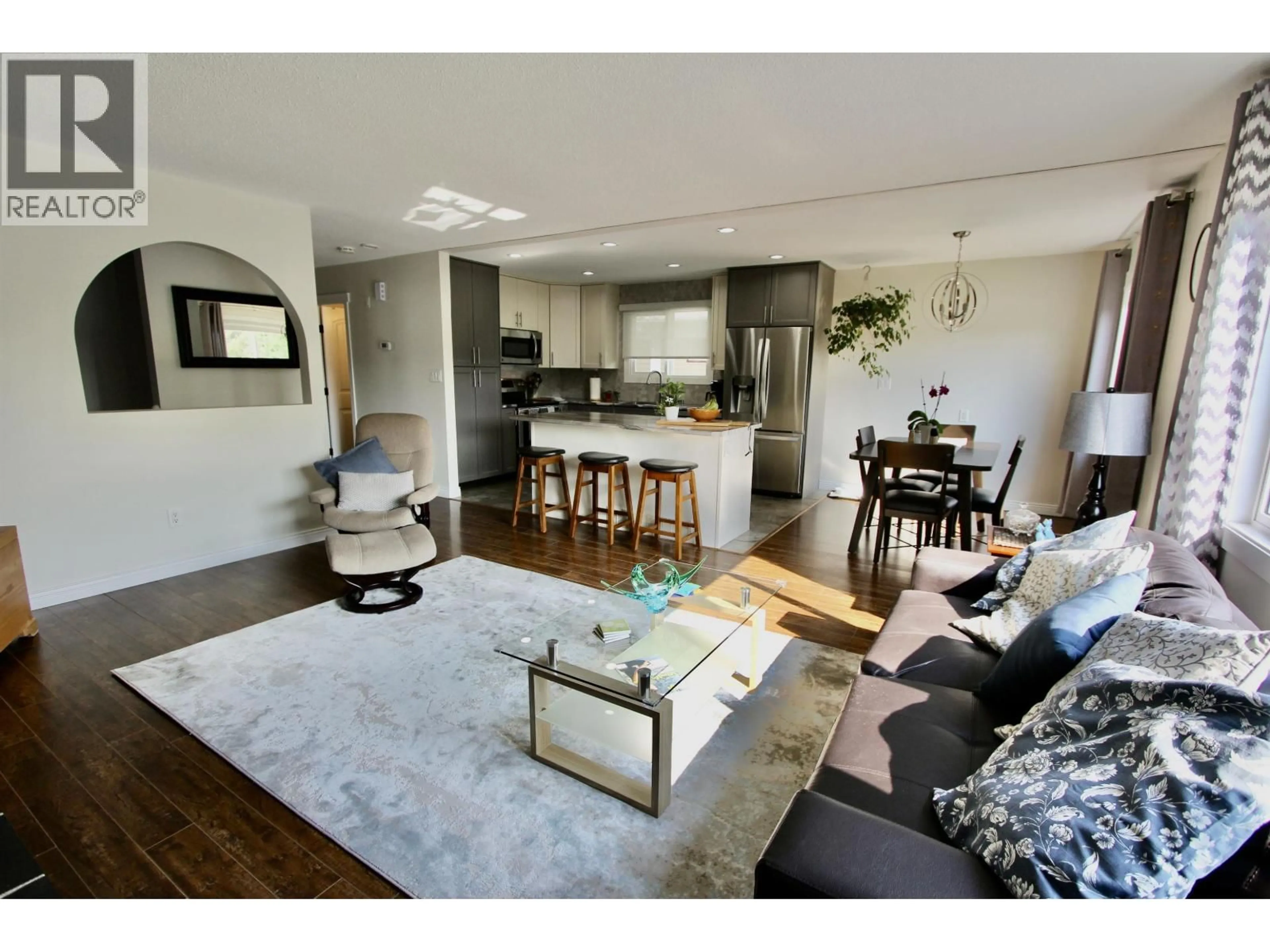 Living room with furniture, wood/laminate floor for 4252 PUNCHAW CRESCENT, Prince George British Columbia V2M5E9
