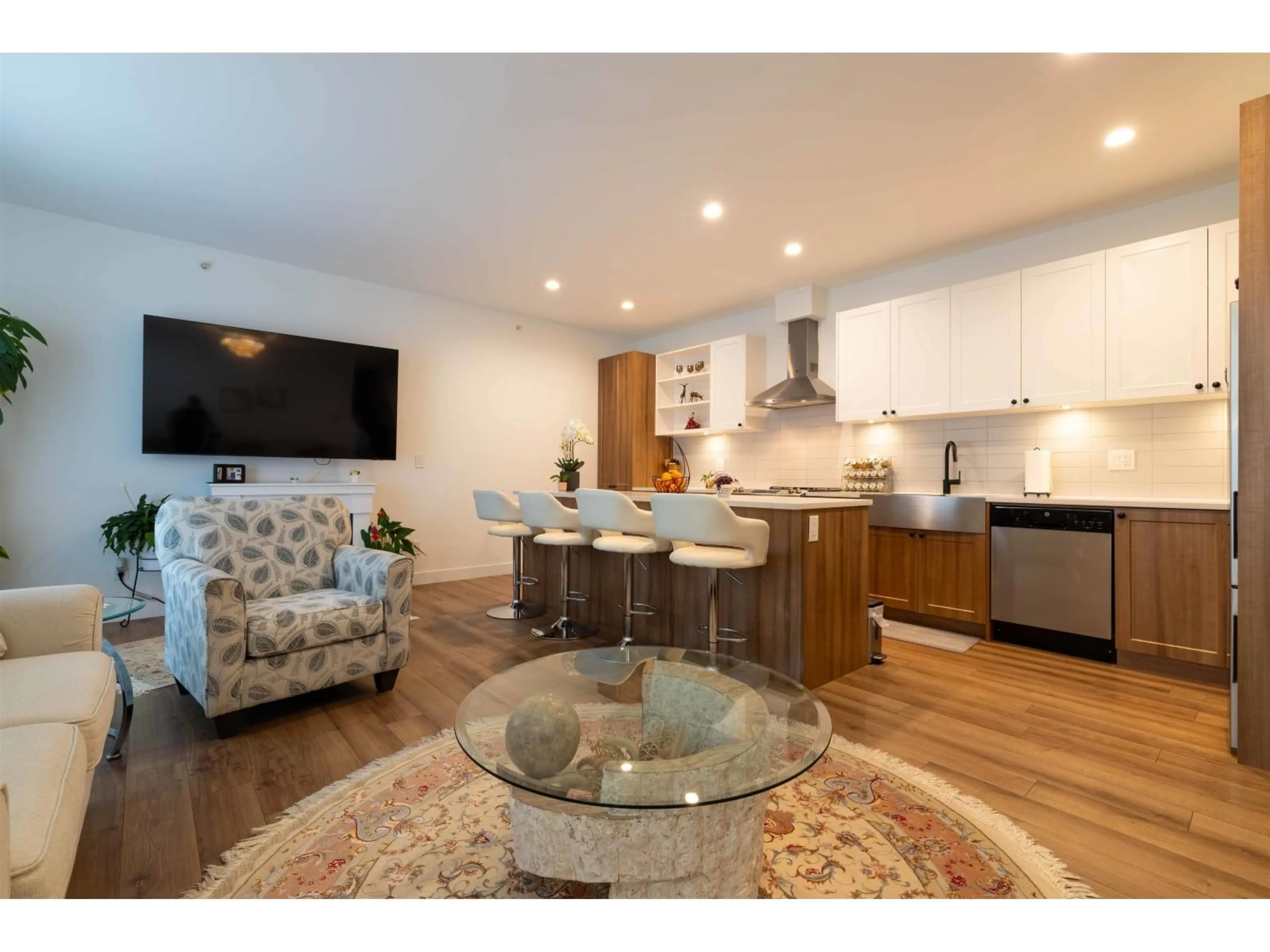 Open concept kitchen, wood/laminate floor for A502 - 20487 65, Langley British Columbia V2Y3K5
