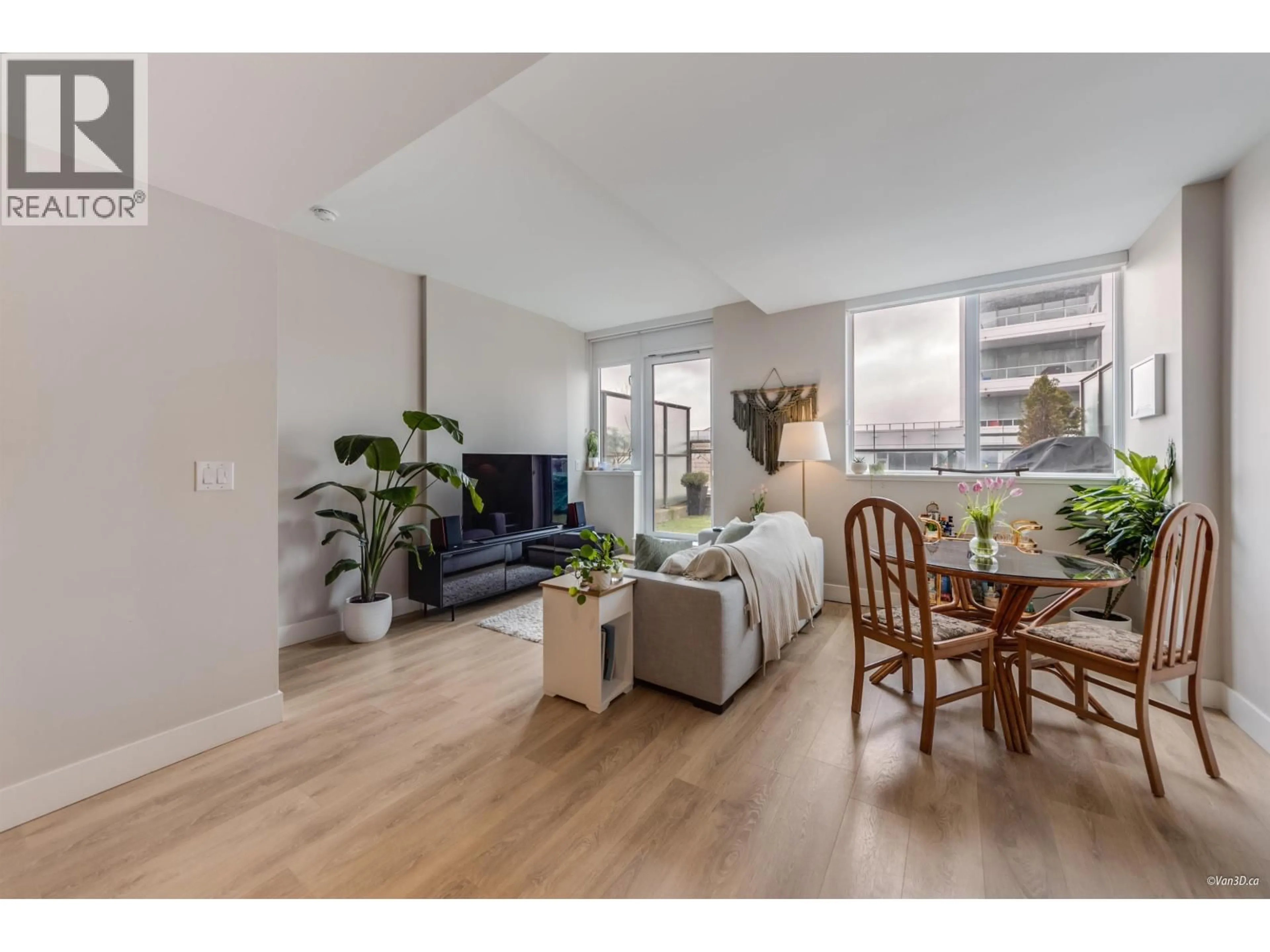 Living room with furniture, wood/laminate floor for 505 - 3451 SAWMILL CRESCENT, Vancouver British Columbia V5S0H3