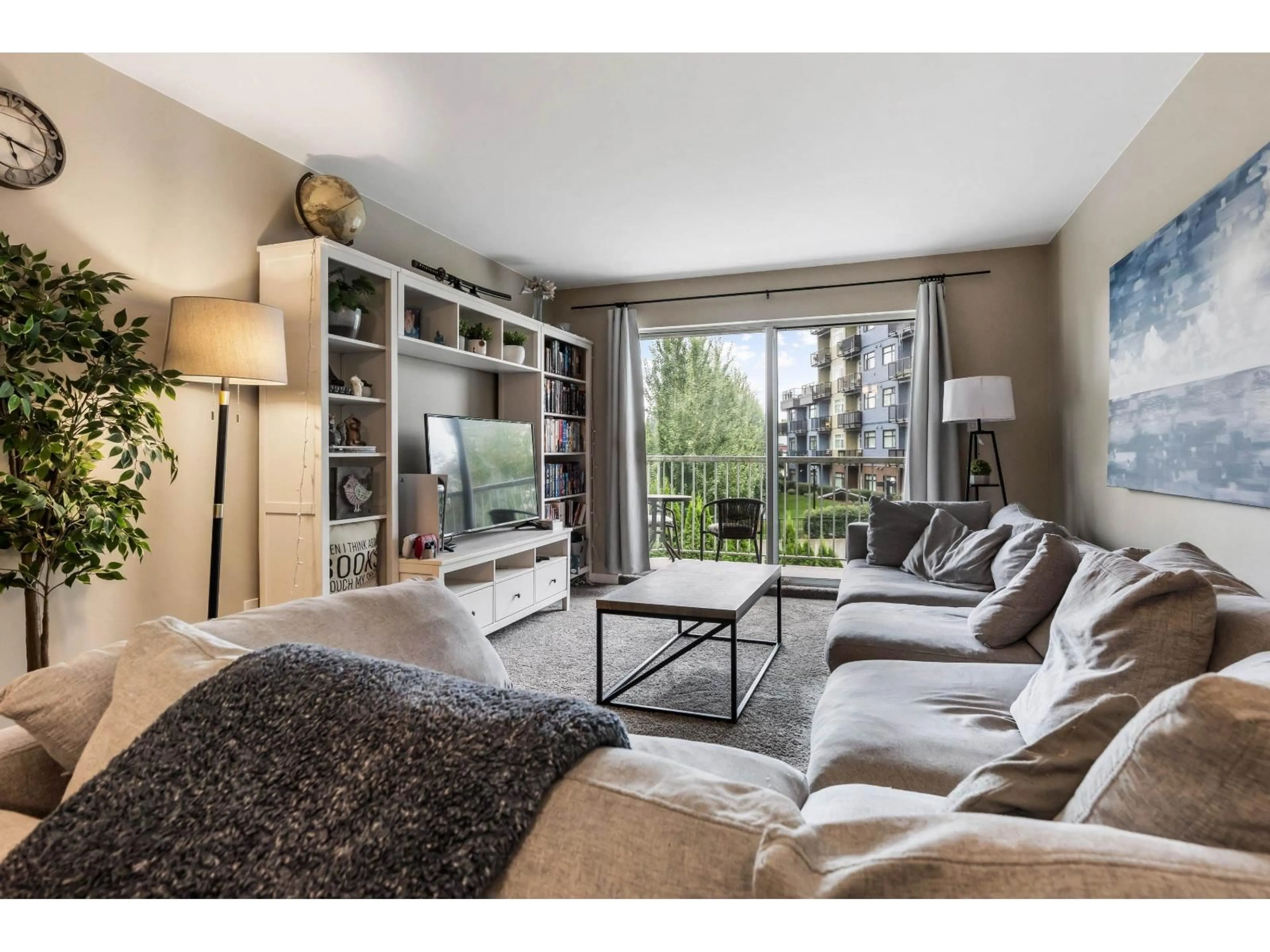 Living room with furniture, wood/laminate floor for 305 - 2750 FULLER, Abbotsford British Columbia V2S3K1