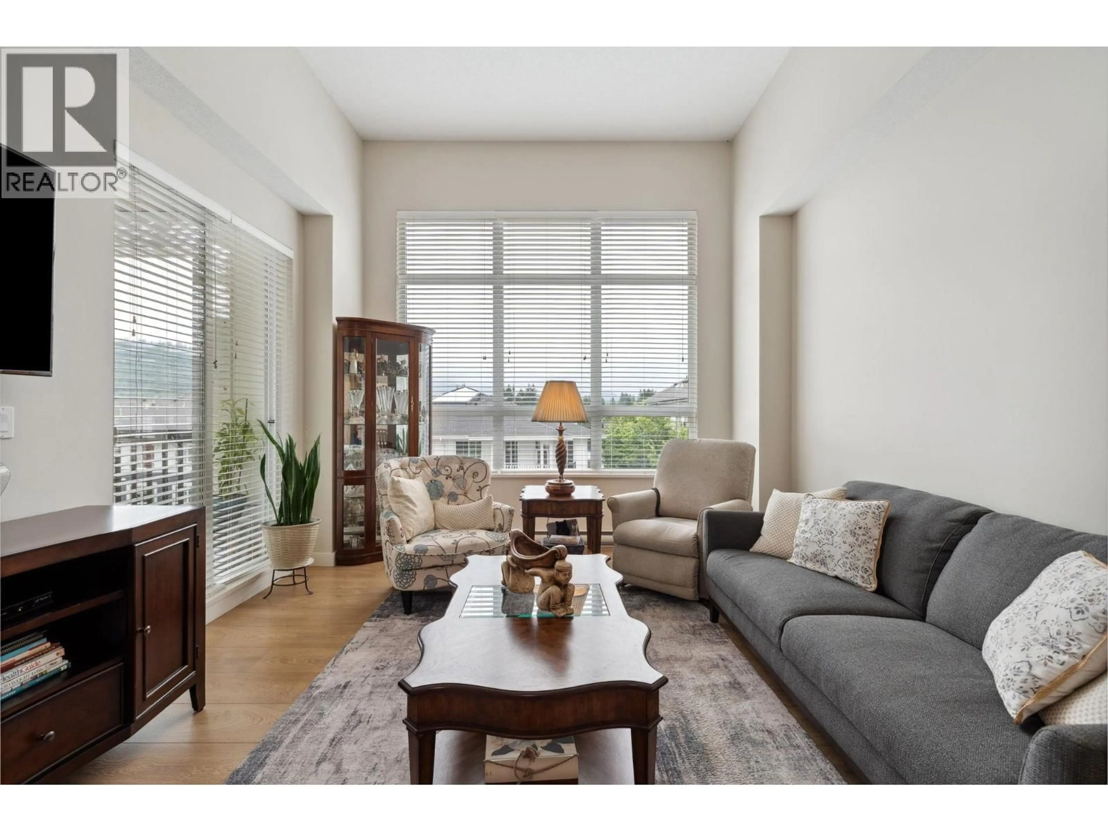 Living room with furniture, wood/laminate floor for 404 - 611 REGAN AVENUE, Coquitlam British Columbia V3J0E5