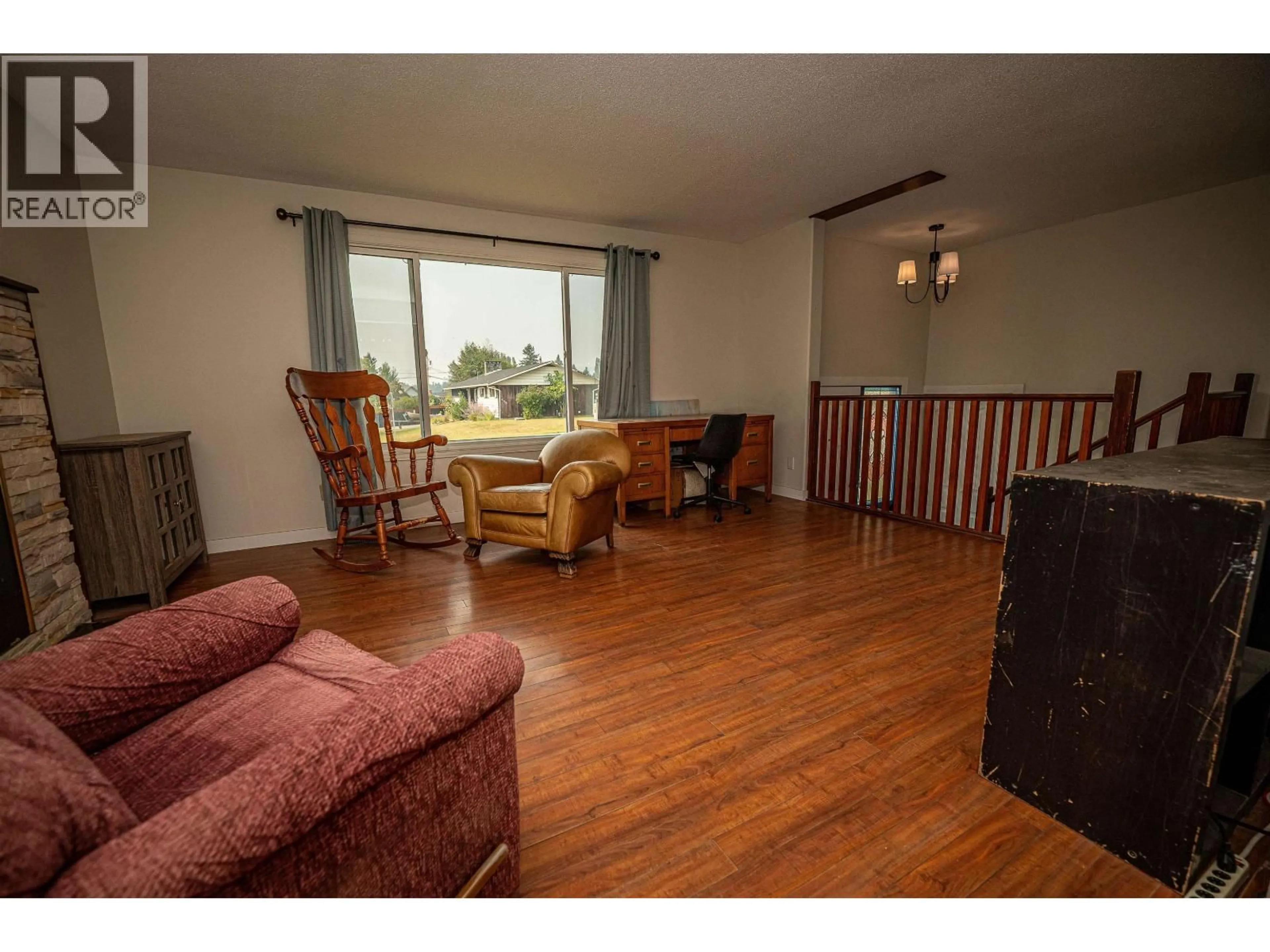 Living room with furniture, wood/laminate floor for 880 PIGEON AVENUE, Williams Lake British Columbia V2G2B7