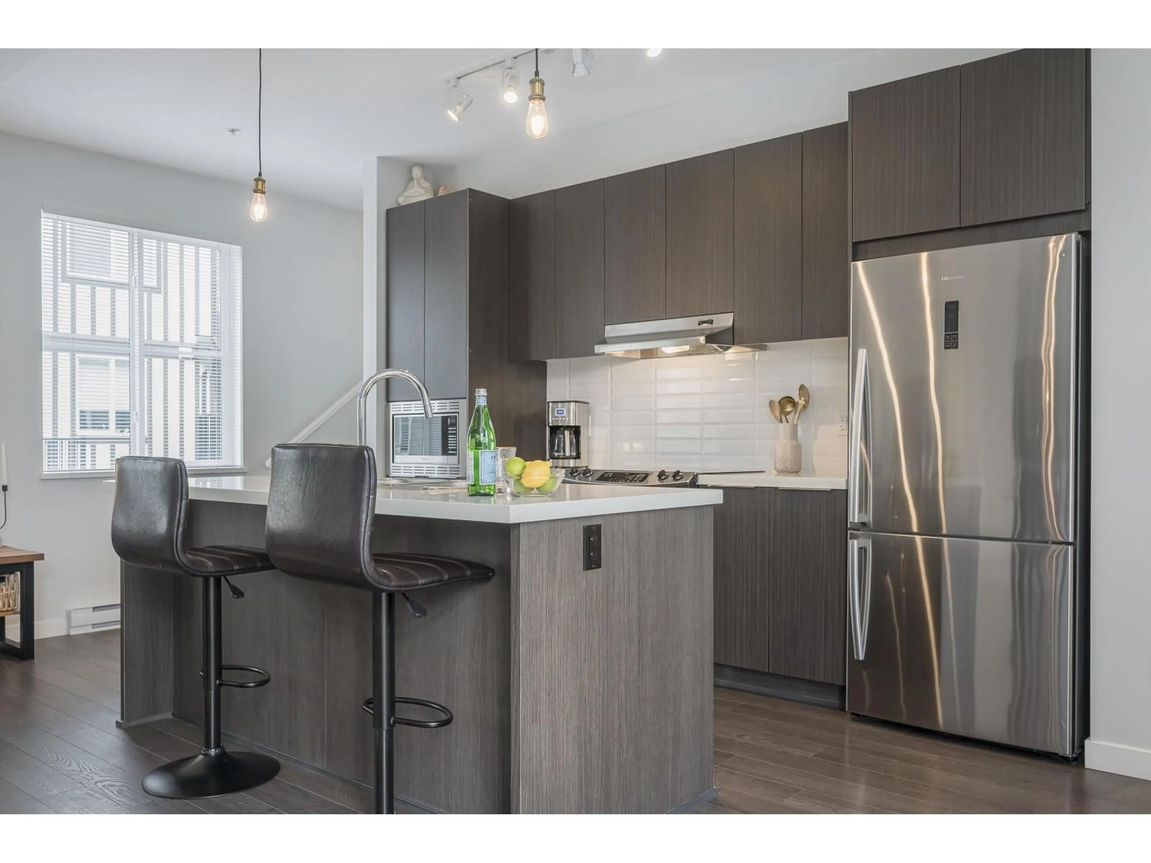 Open concept kitchen, wood/laminate floor for 37 - 8050 204, Langley British Columbia V2Y0X1