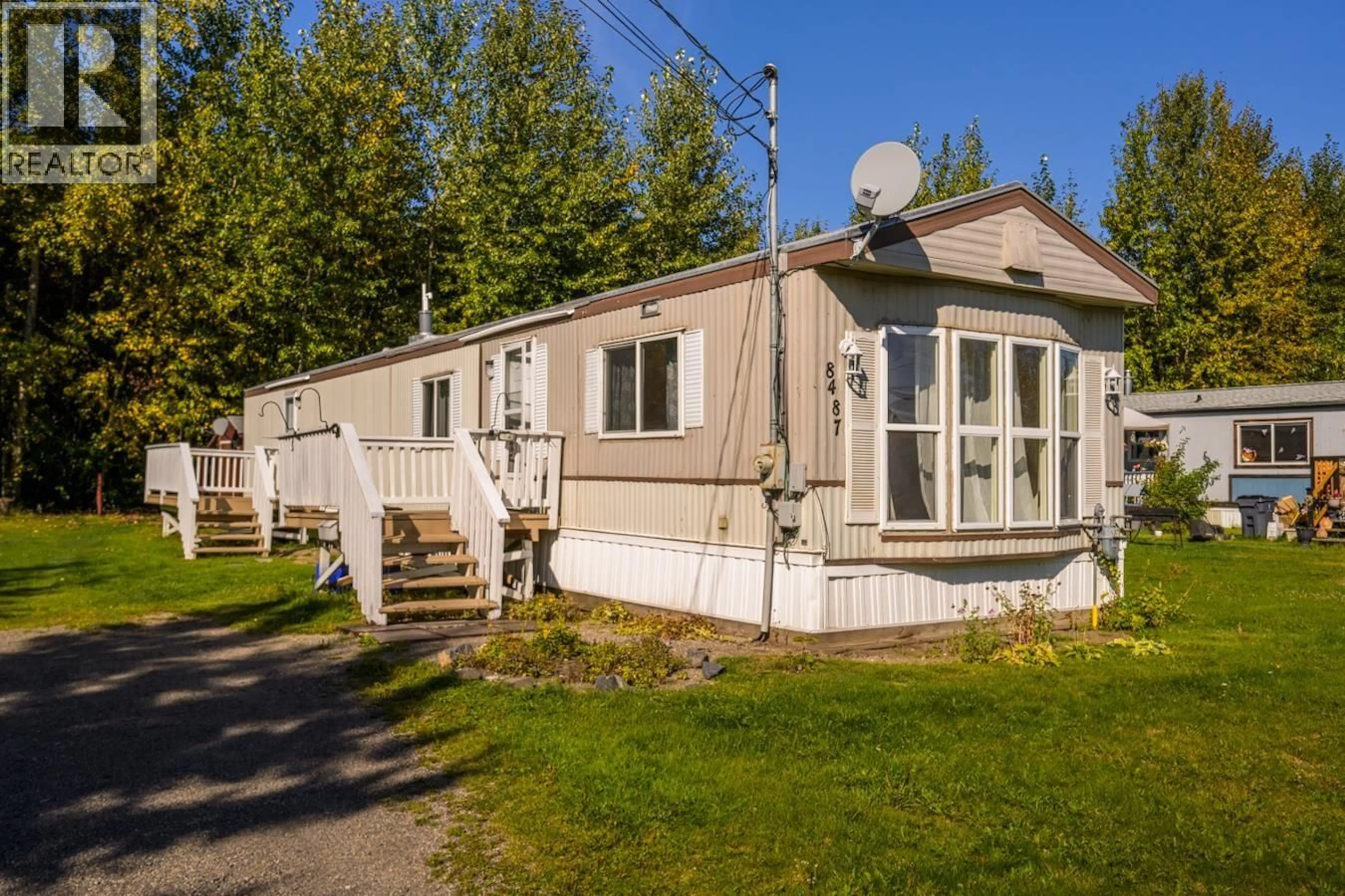 Home with vinyl exterior material, street for 8487 PETER ROAD, Prince George British Columbia V2K2W3