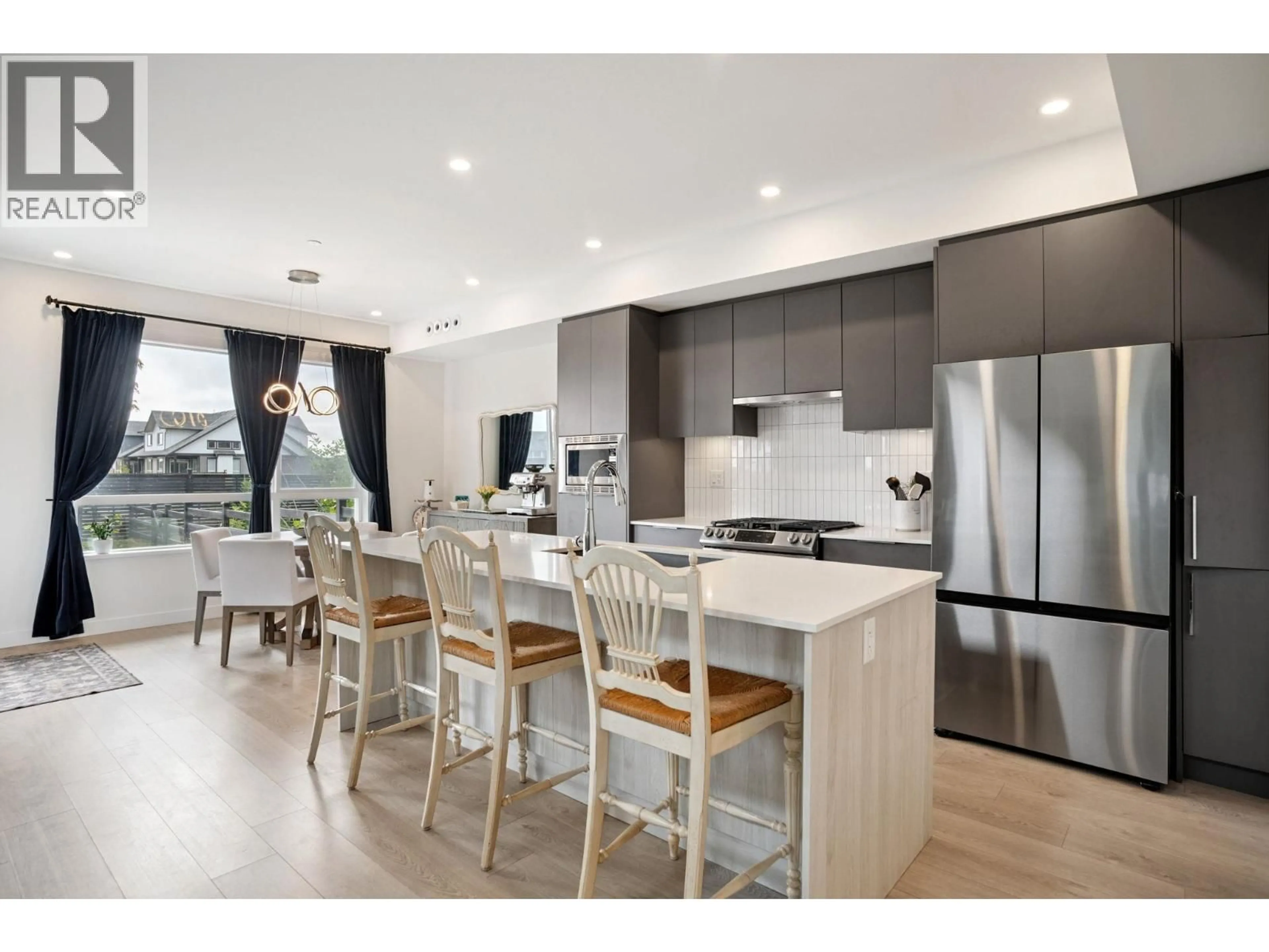 Open concept kitchen, wood/laminate floor for 4 - 4375 CORMORANT WAY, Tsawwassen British Columbia V4M0G3