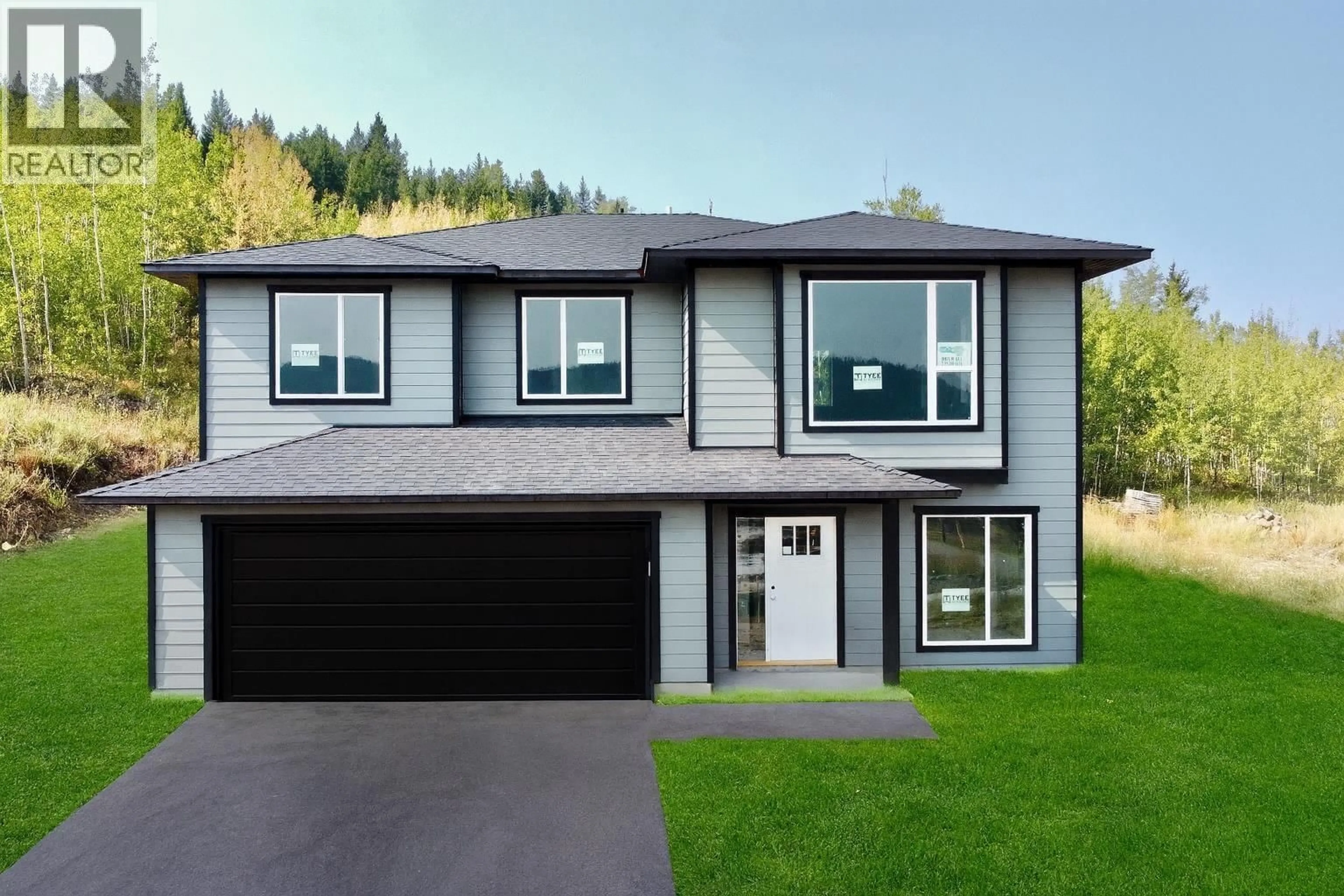 Home with vinyl exterior material, street for 905 SPRUCE PLACE, 100 Mile House British Columbia V0K2E0