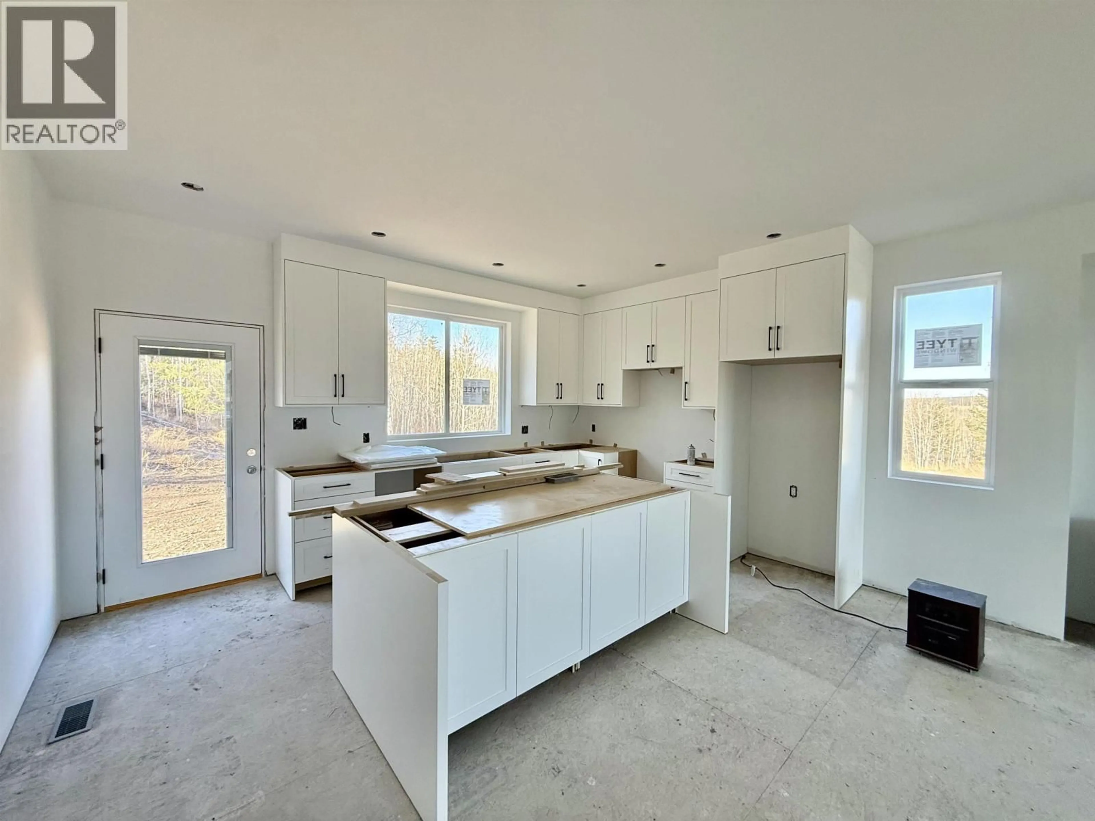 Open concept kitchen, ceramic/tile floor for 905 SPRUCE PLACE, 100 Mile House British Columbia V0K2E0