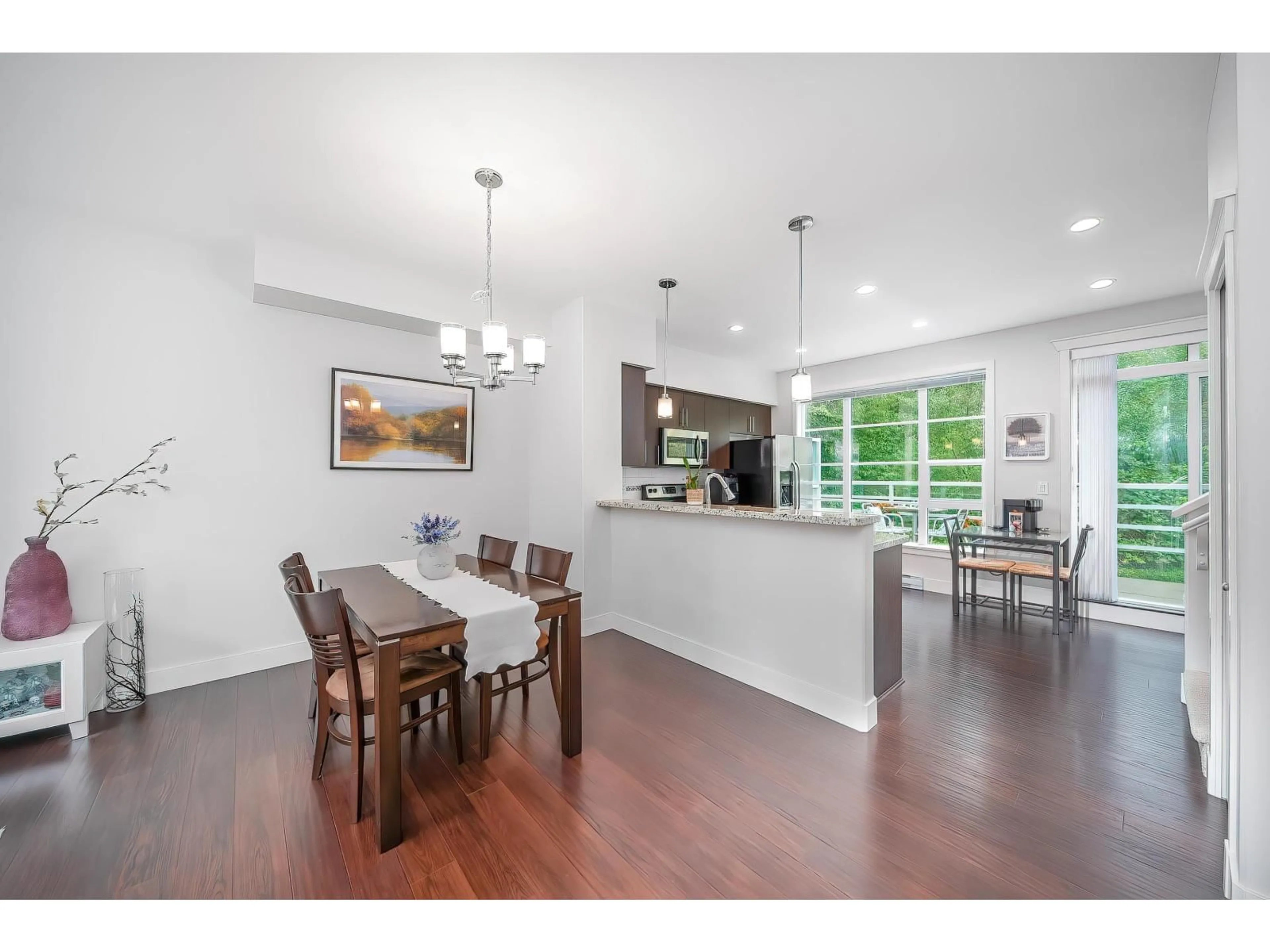 Open concept kitchen, wood/laminate floor for 49 - 15405 31, Surrey British Columbia V3Z2W5