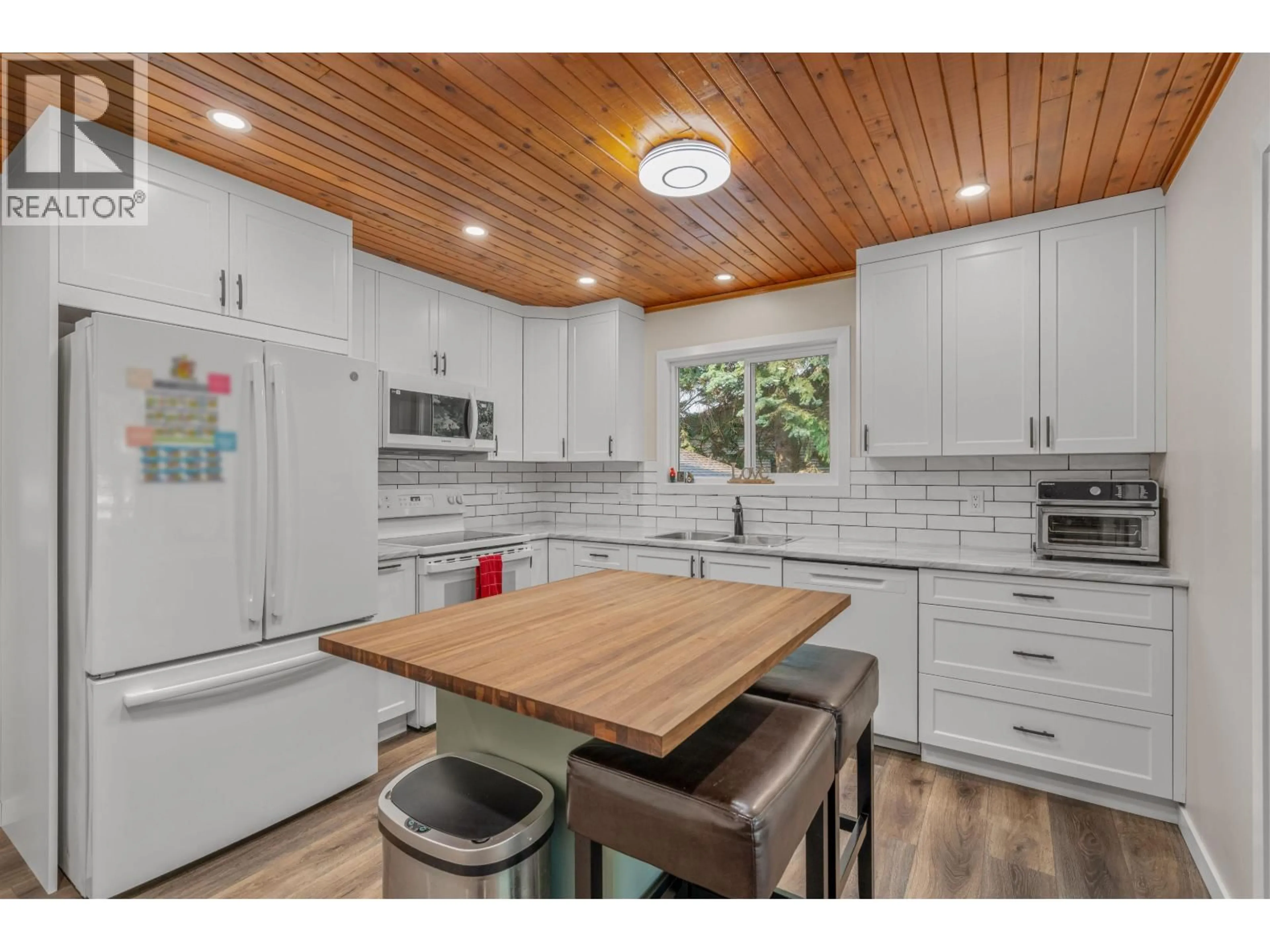 Open concept kitchen, wood/laminate floor for 2840 MCKENNEY CRESCENT, Prince George British Columbia V2K3X9