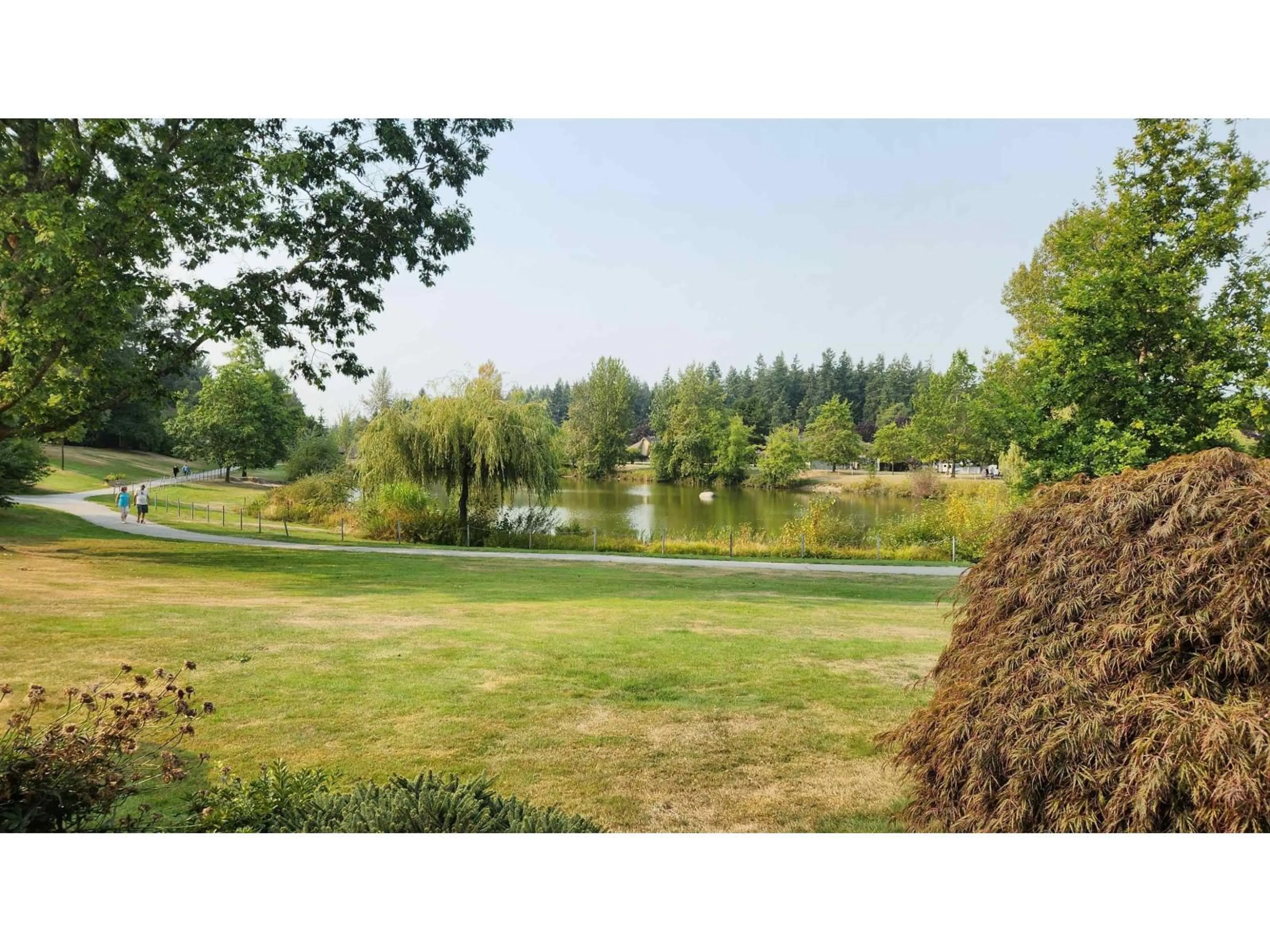 A pic from outside/outdoor area/front of a property/back of a property/a pic from drone, water/lake/river/ocean view for 102 - 6086 BOUNDARY WEST, Surrey British Columbia V3X2B3
