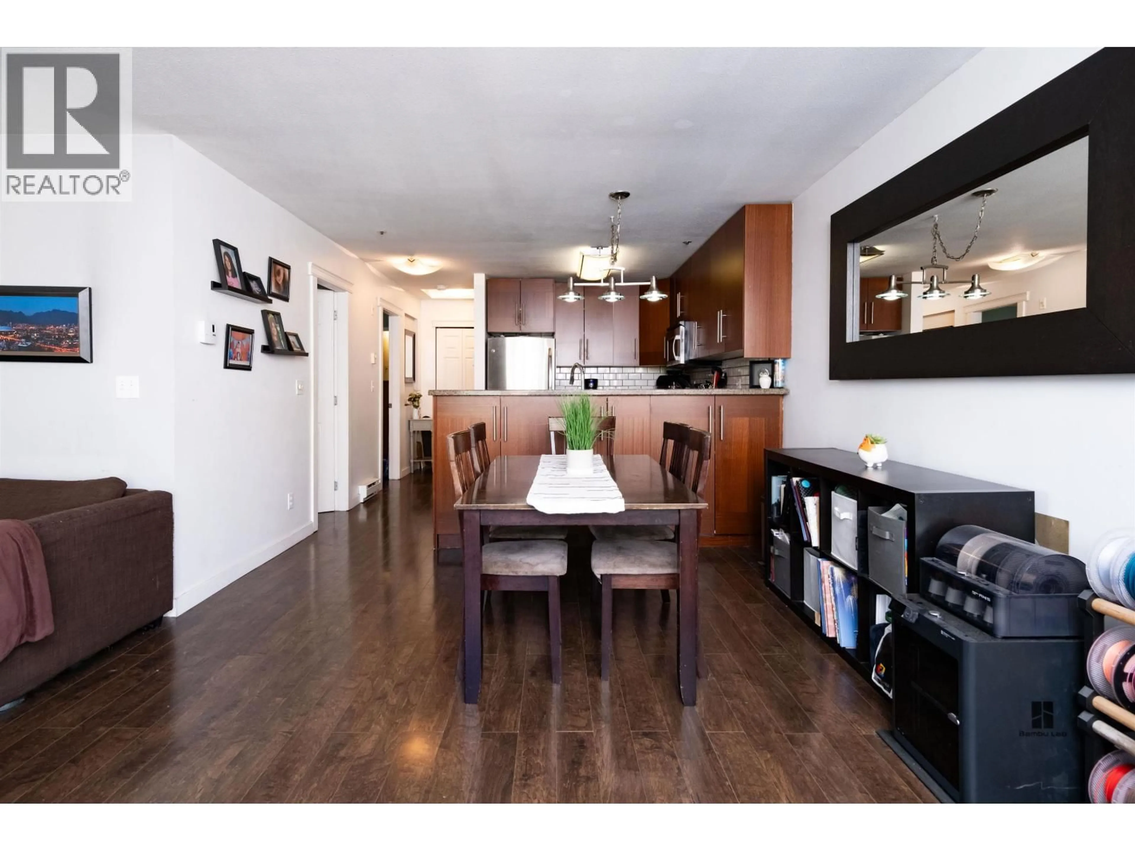 Open concept kitchen, wood/laminate floor for 403 - 118 2ND STREET, North Vancouver British Columbia V7L1C3