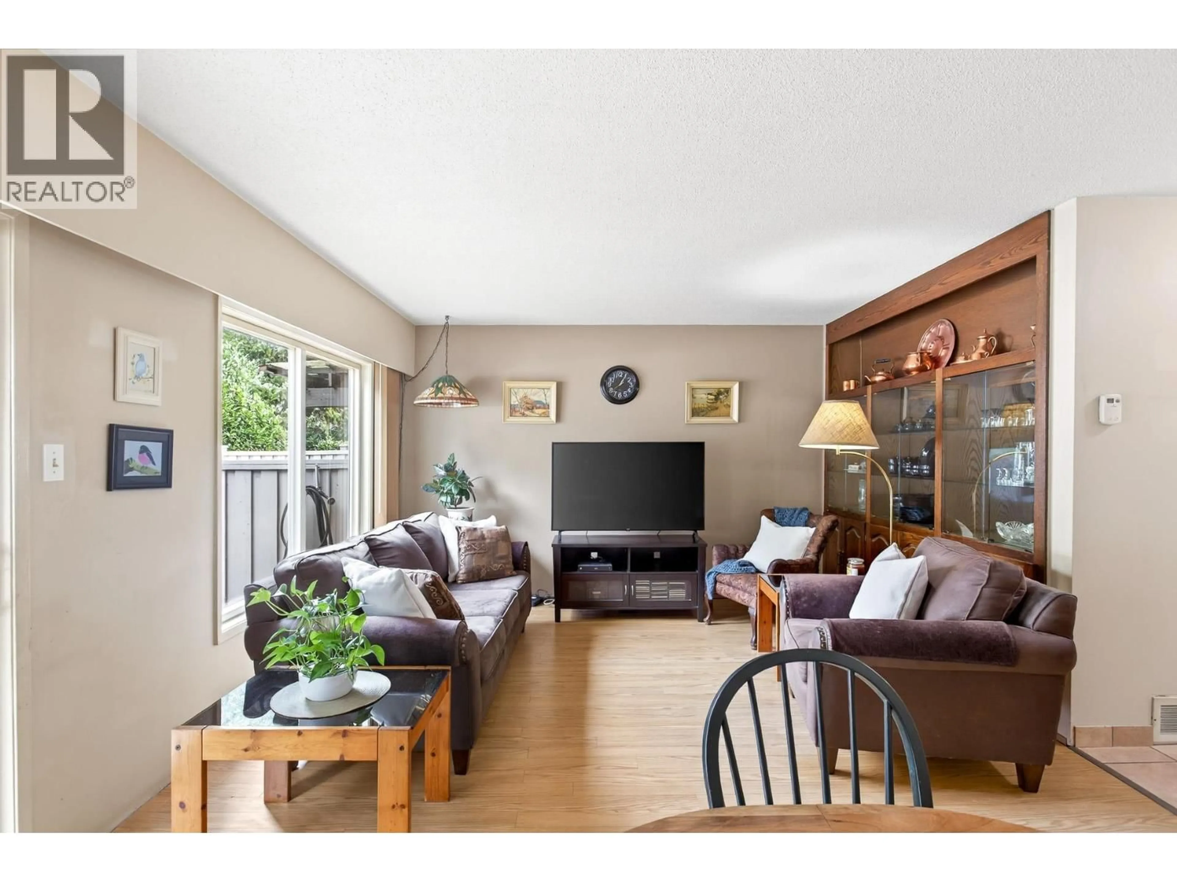 Living room with furniture, wood/laminate floor for 7 - 3046 COAST MERIDIAN ROAD, Port Coquitlam British Columbia V3B5B6