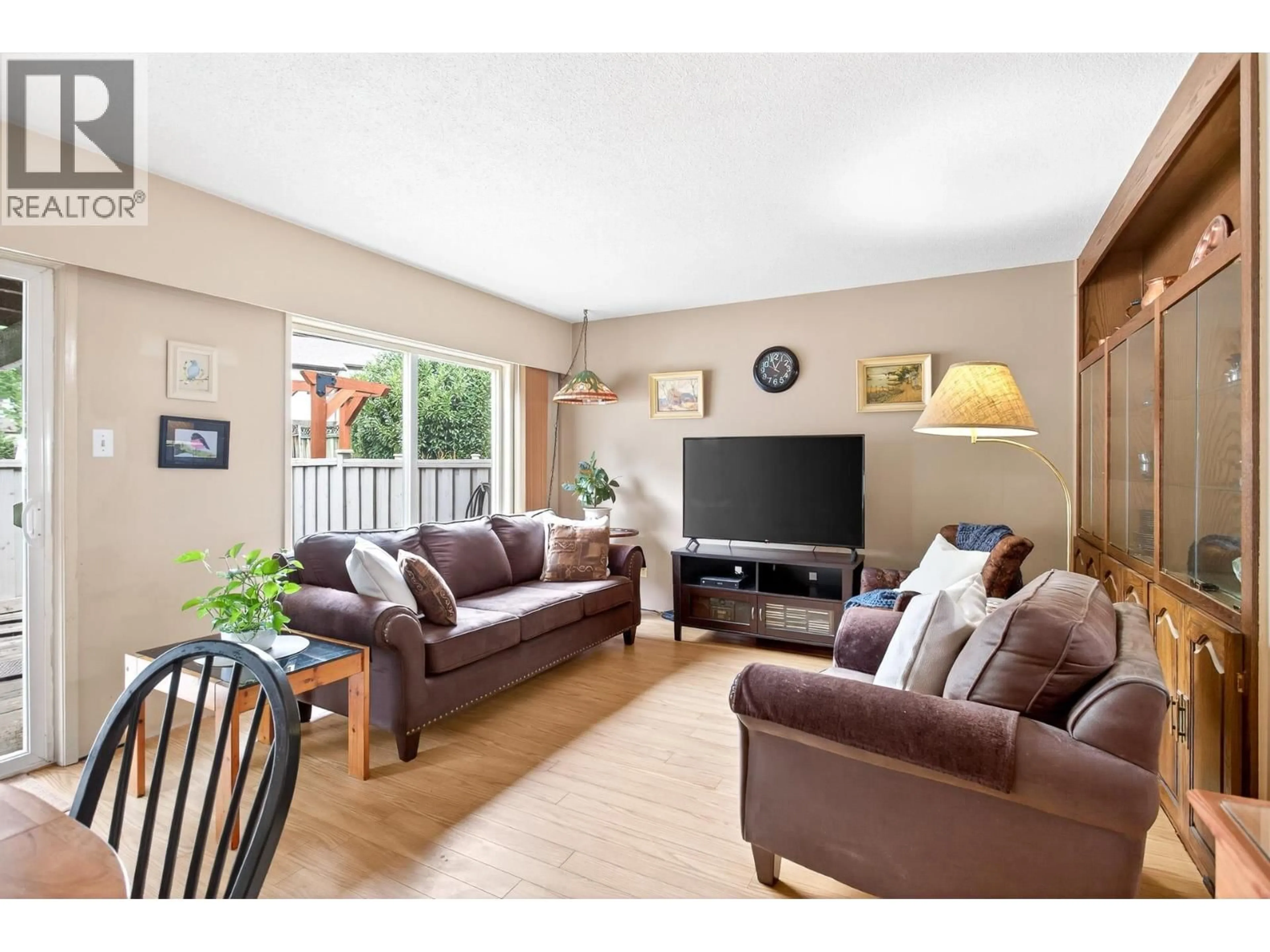 Living room with furniture, wood/laminate floor for 7 - 3046 COAST MERIDIAN ROAD, Port Coquitlam British Columbia V3B5B6