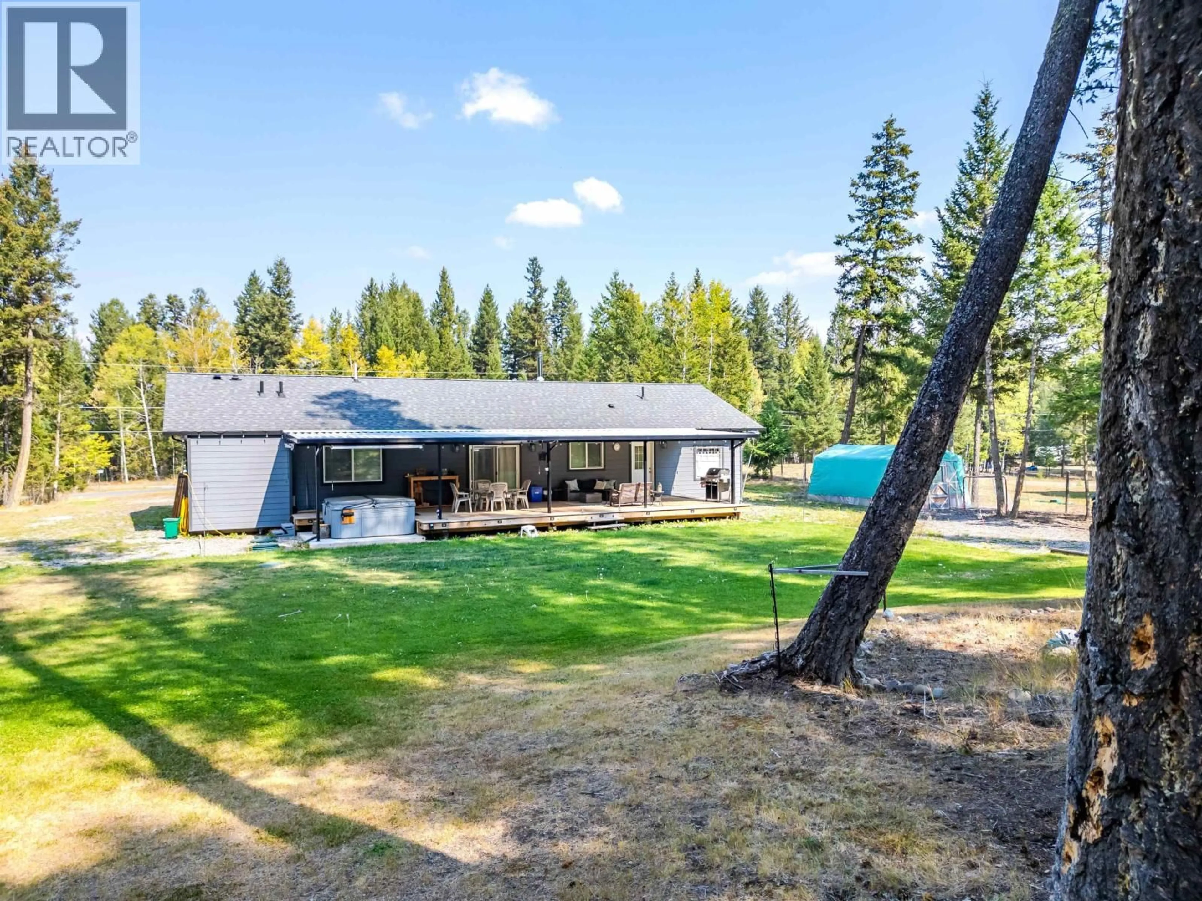 A pic from outside/outdoor area/front of a property/back of a property/a pic from drone, forest/trees view for 5310 KALLUM DRIVE, 108 Mile Ranch British Columbia V0K2Z0