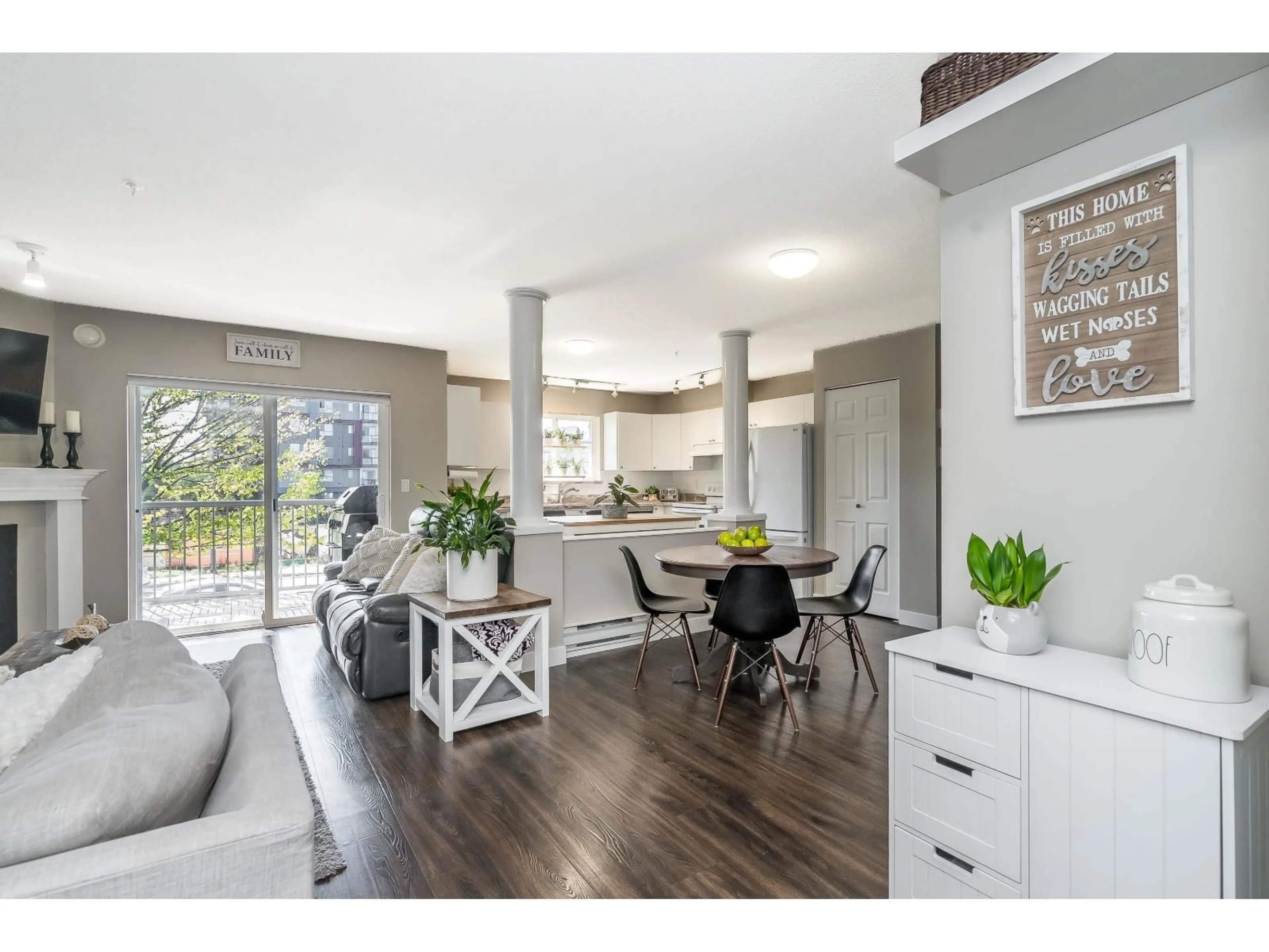 Open concept kitchen, wood/laminate floor for 205 19953 55A, Langley British Columbia V3A3X4