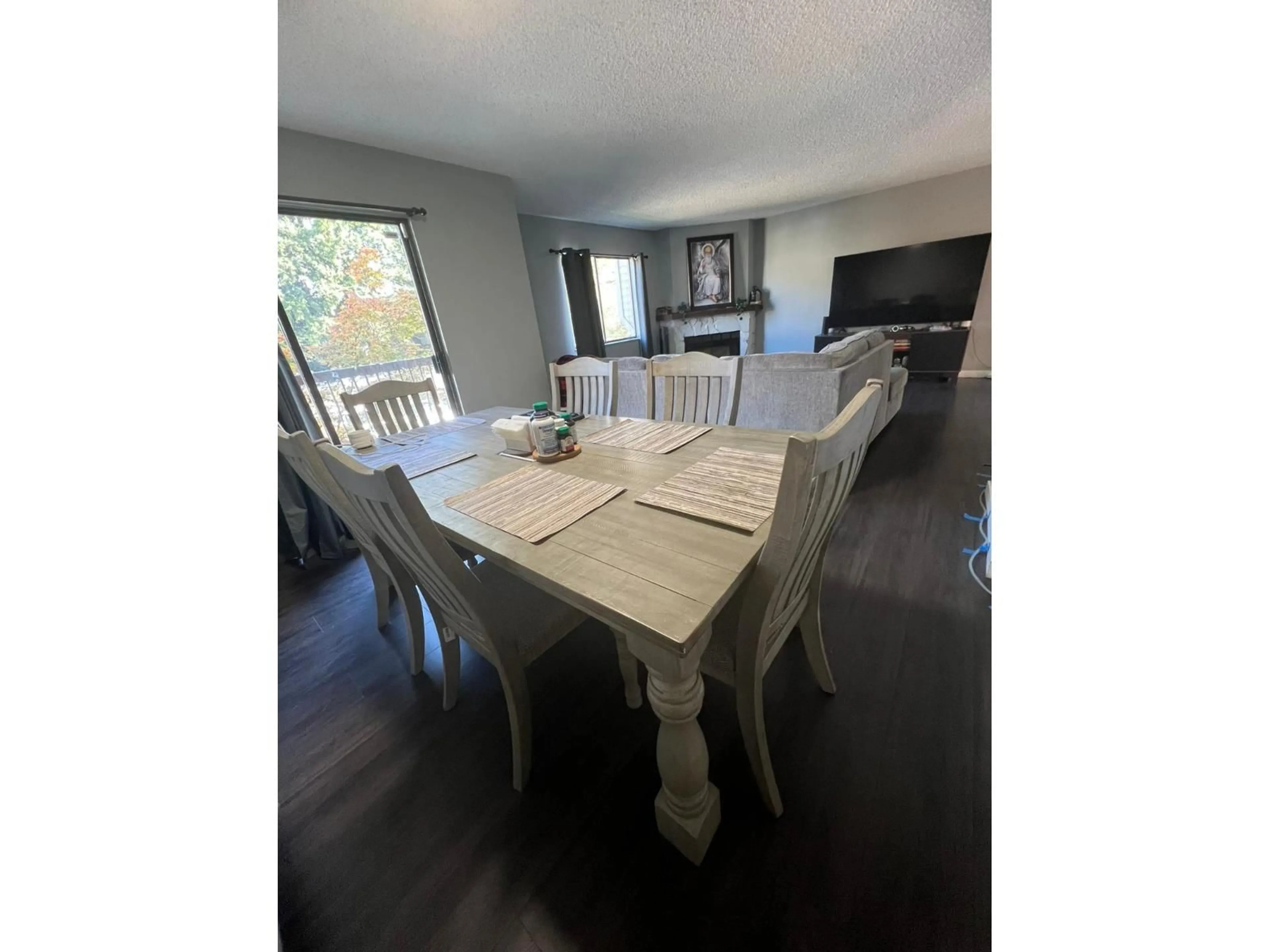 Dining room, wood/laminate floor for 201 - 7131 133A, Surrey British Columbia V3W8A1