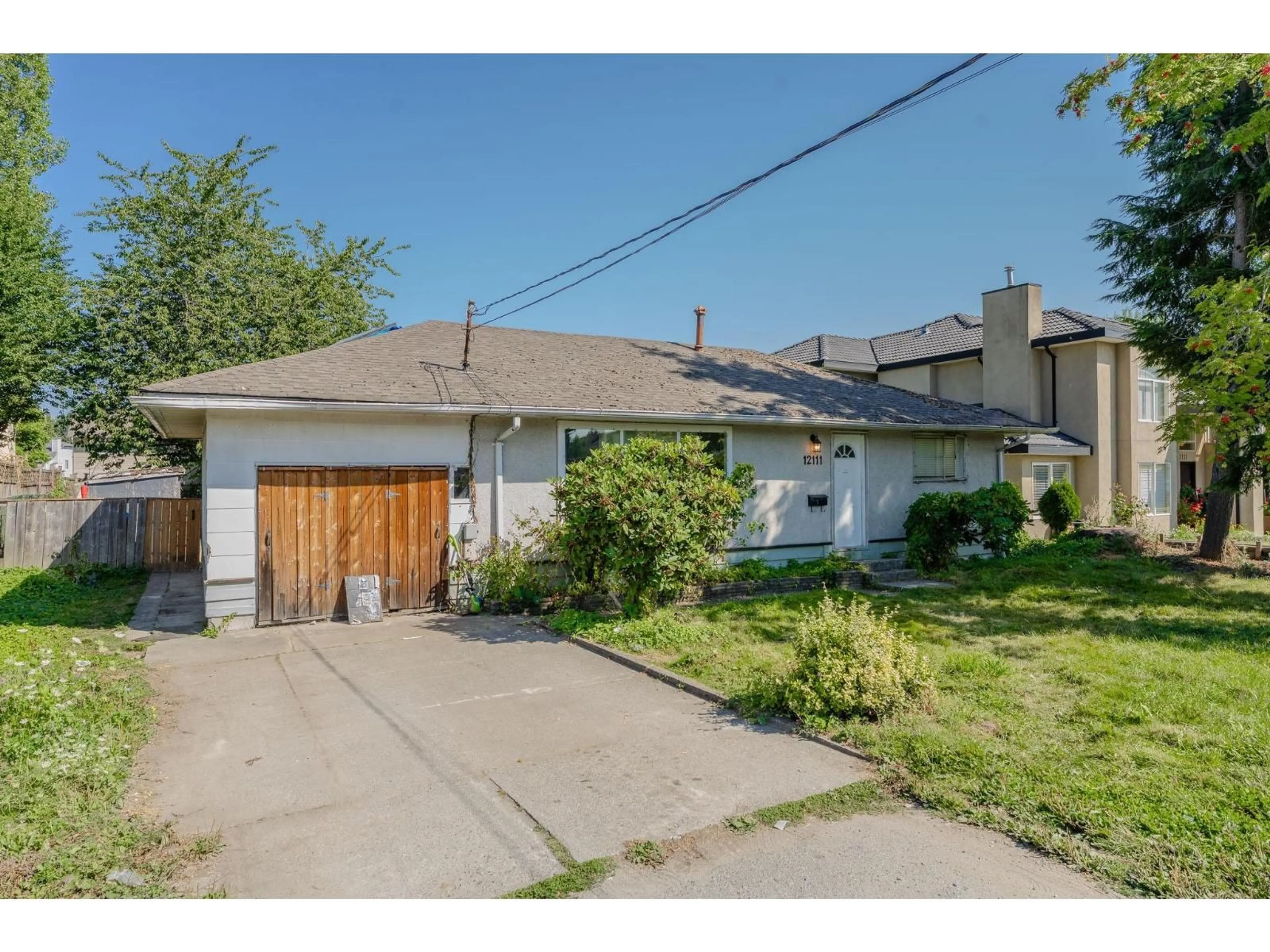 A pic from outside/outdoor area/front of a property/back of a property/a pic from drone, street for 12111 84, Surrey British Columbia V3W3G4