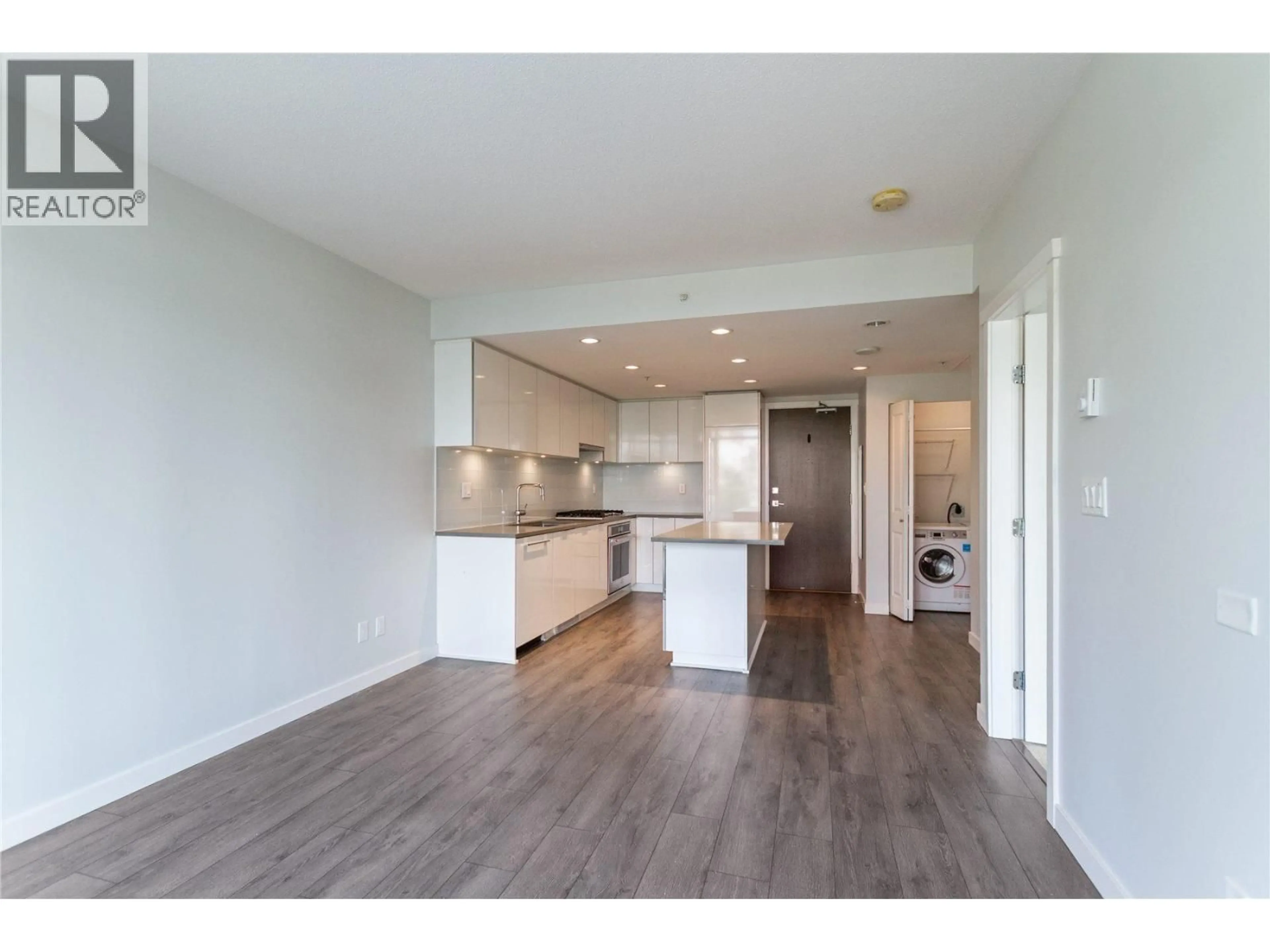 Open concept kitchen, wood/laminate floor for 409 - 2388 MADISON AVENUE, Burnaby British Columbia V5C0K8