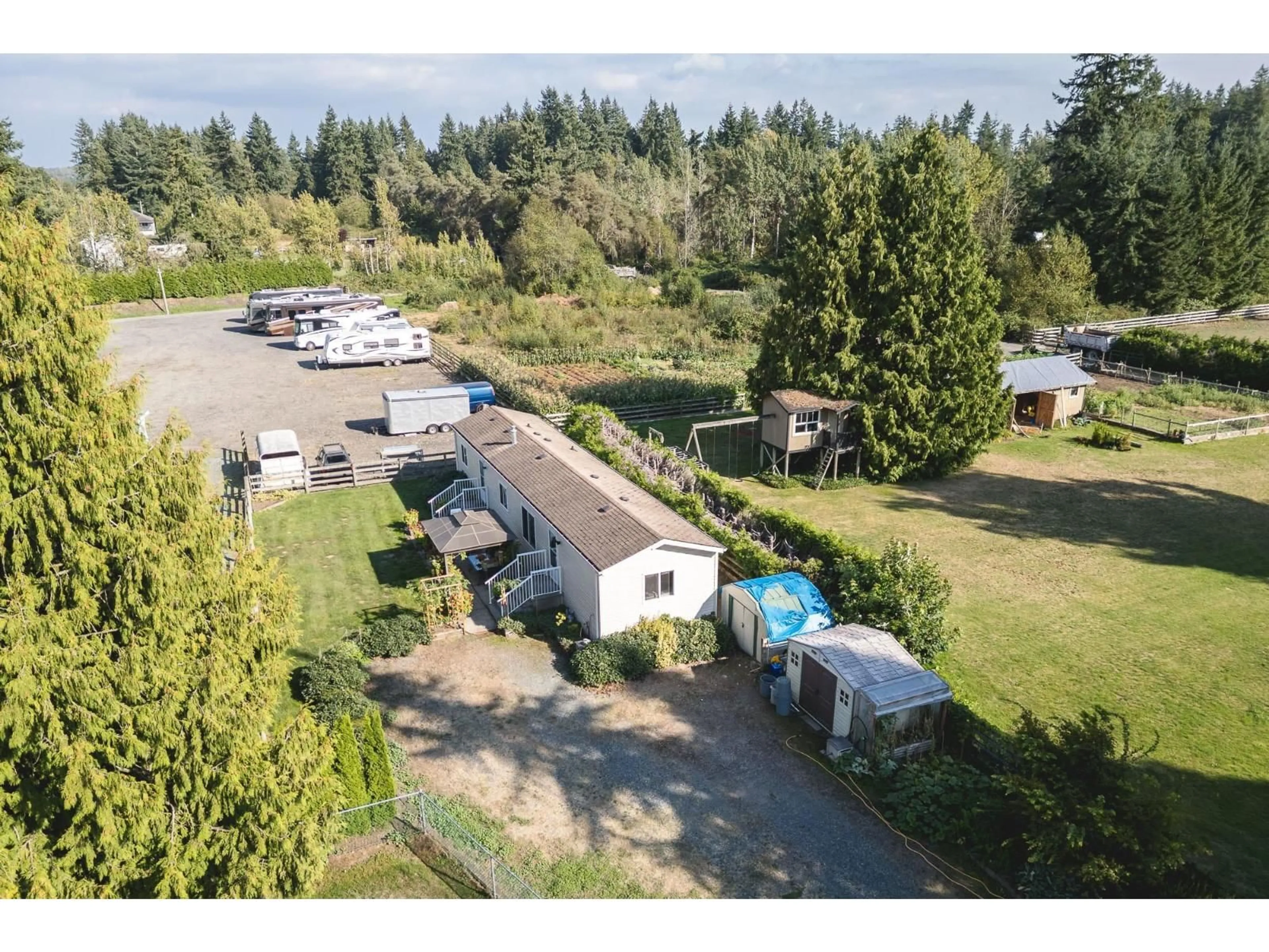 A pic from outside/outdoor area/front of a property/back of a property/a pic from drone, unknown for 2794 204, Langley British Columbia V2Z2B8