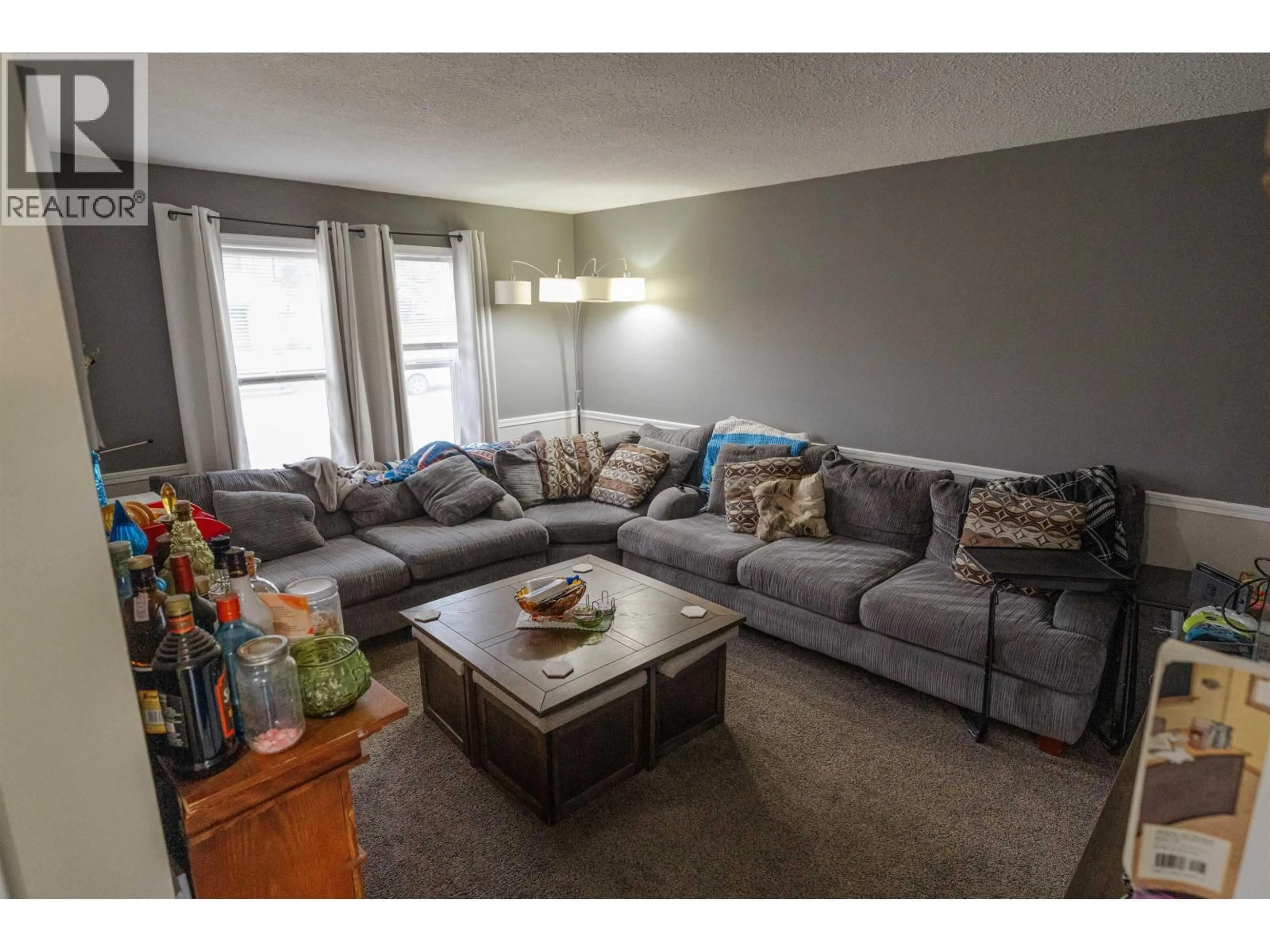 Living room with furniture, unknown for 10219 102 AVENUE, Fort St. John British Columbia V1J2E4
