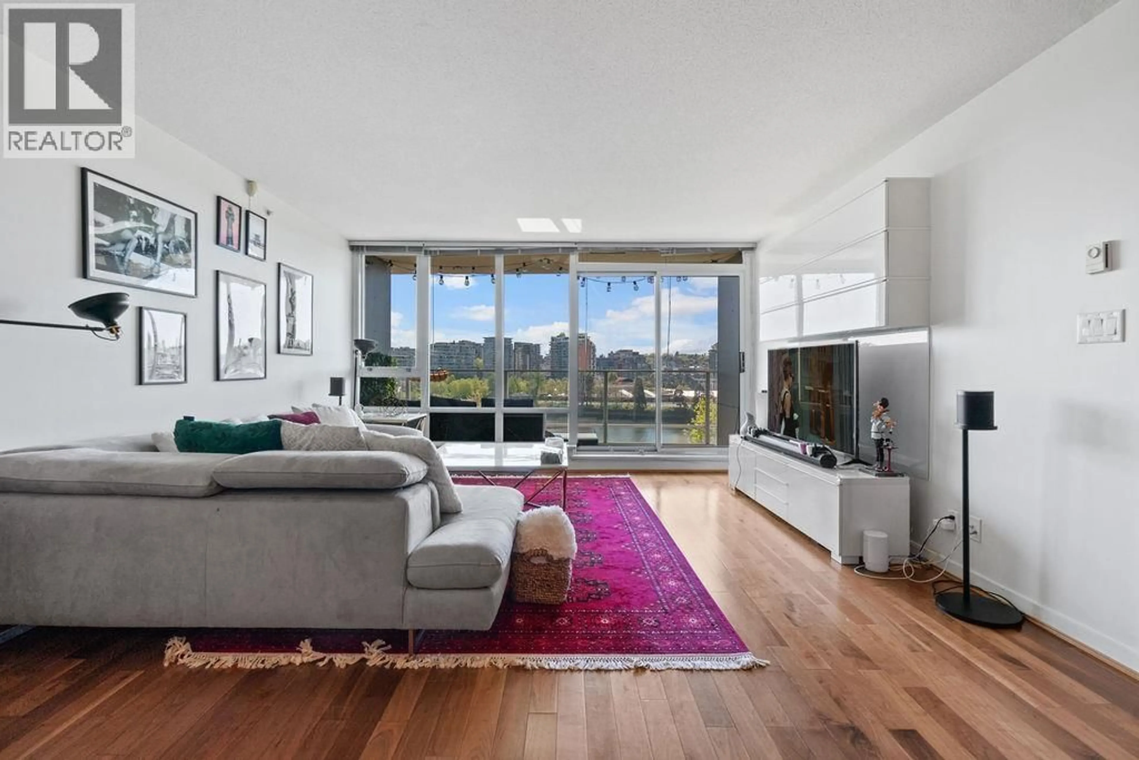 Living room with furniture, unknown for 801 - 980 COOPERAGE WAY, Vancouver British Columbia V6B0C3
