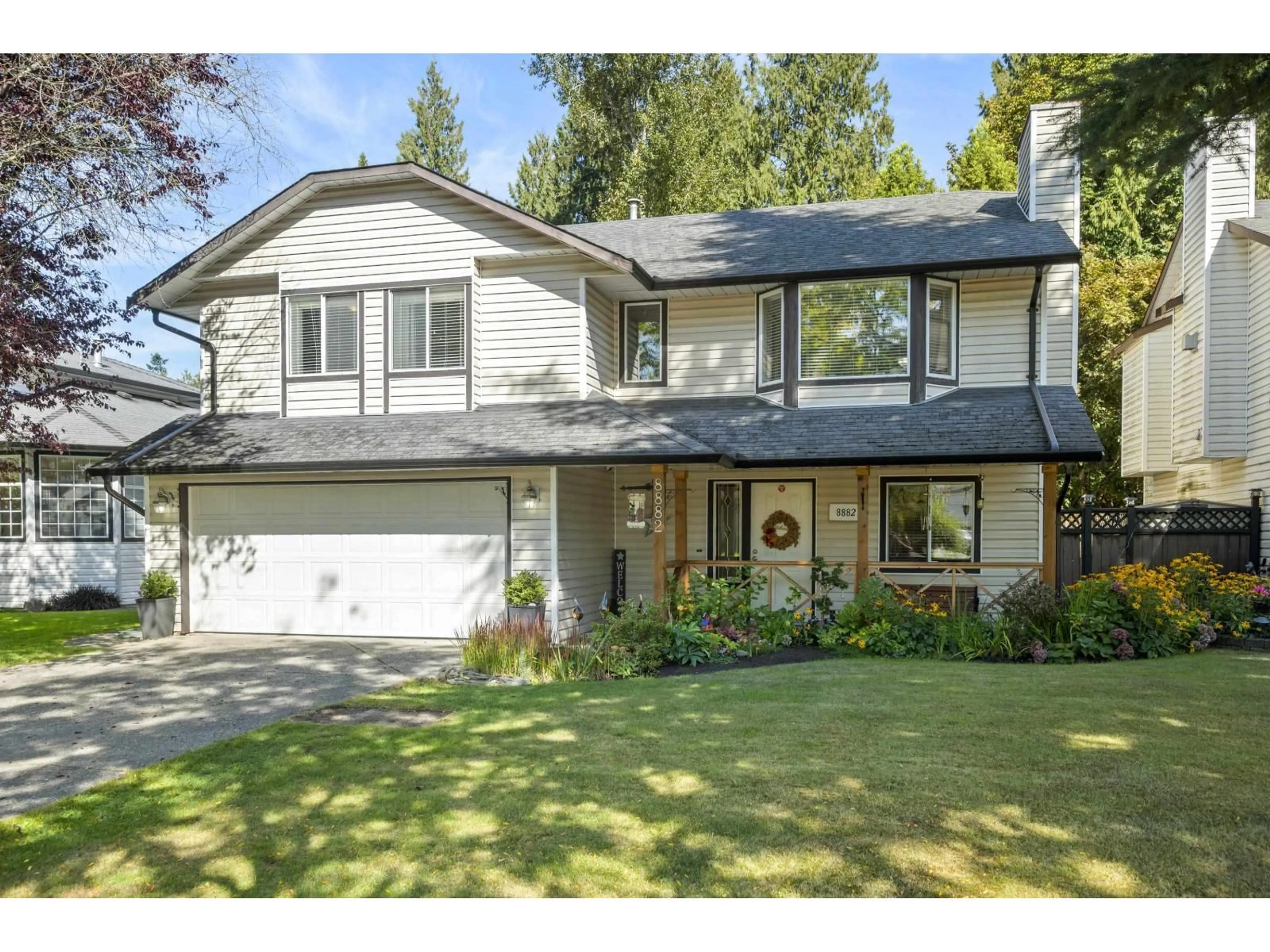 Home with vinyl exterior material, street for 8882 214B, Langley British Columbia V1M1Y3