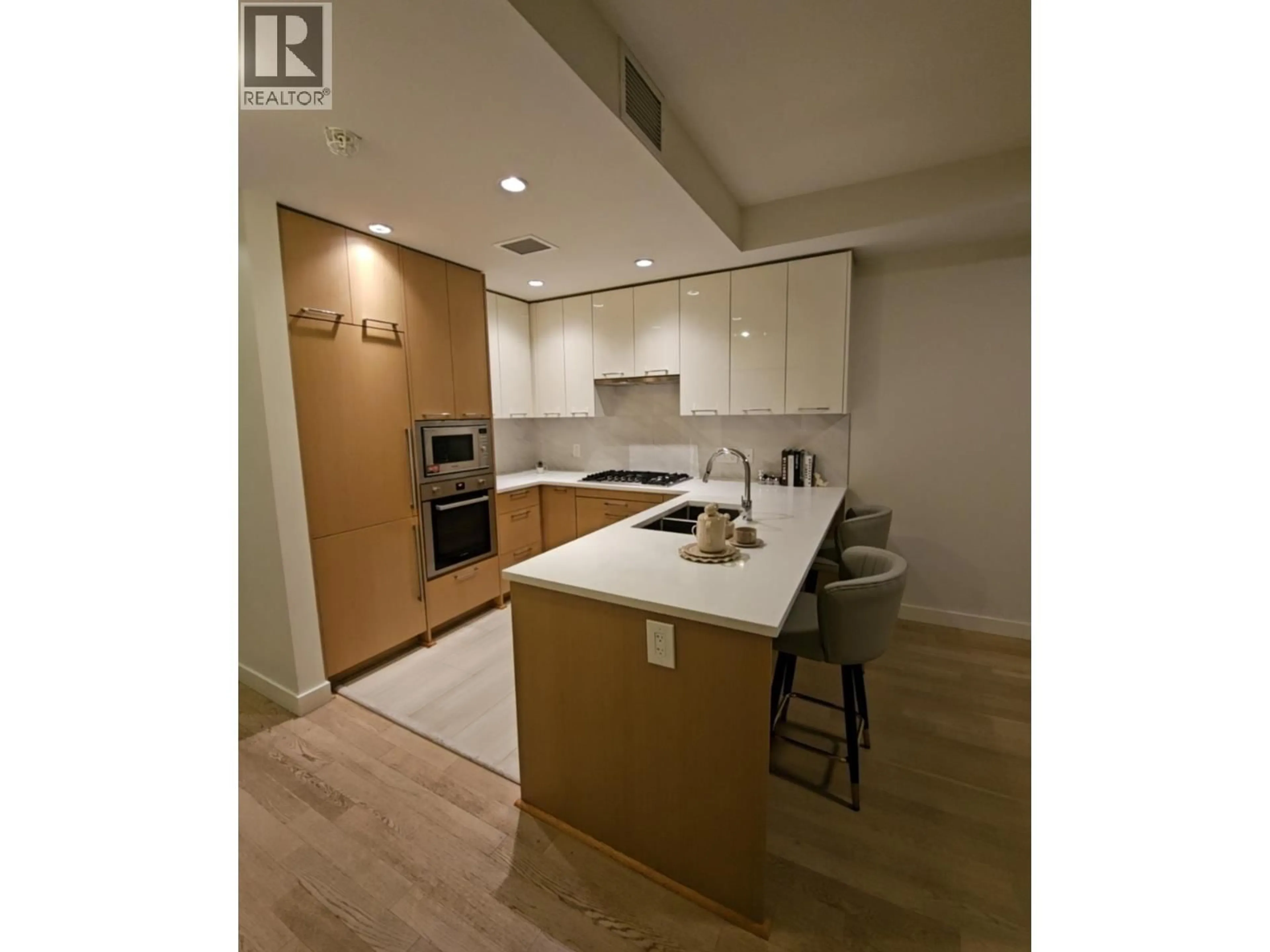 Open concept kitchen, wood/laminate floor for 315 - 4033 MAY DRIVE, Richmond British Columbia V6X0T3