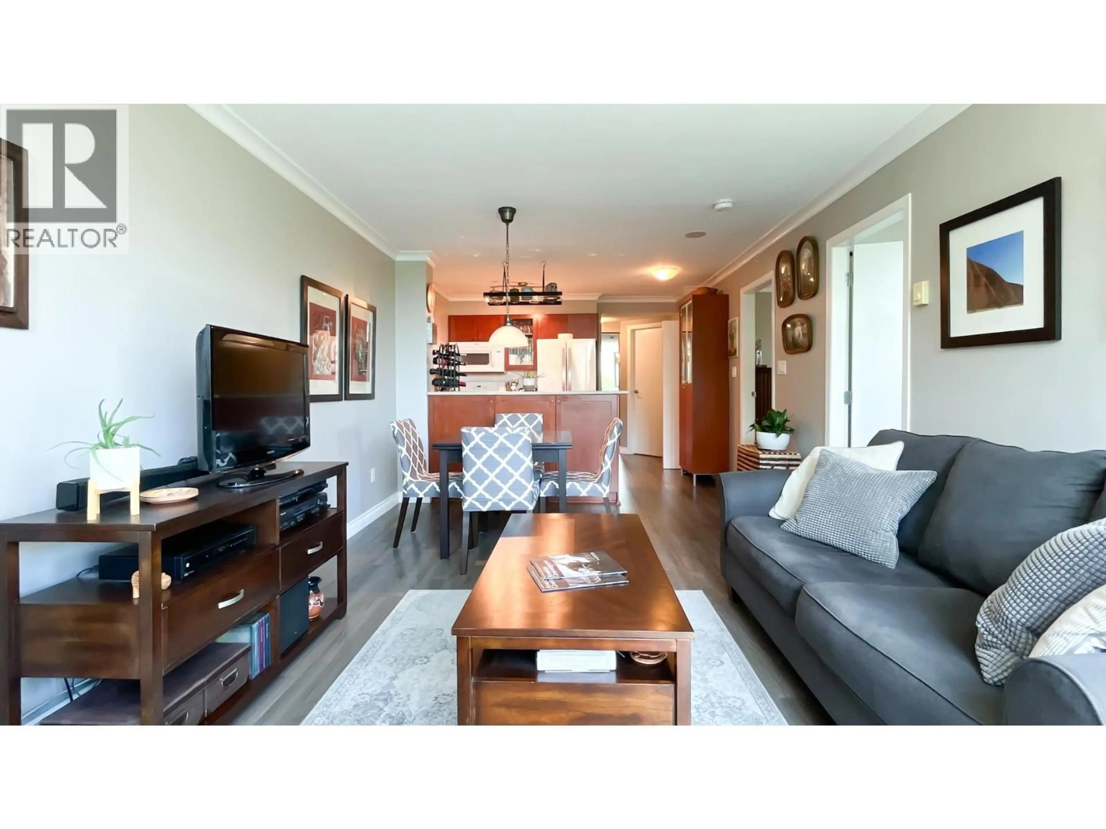 Living room with furniture, wood/laminate floor for 206 - 2733 CHANDLERY PLACE, Vancouver British Columbia V5S4V3
