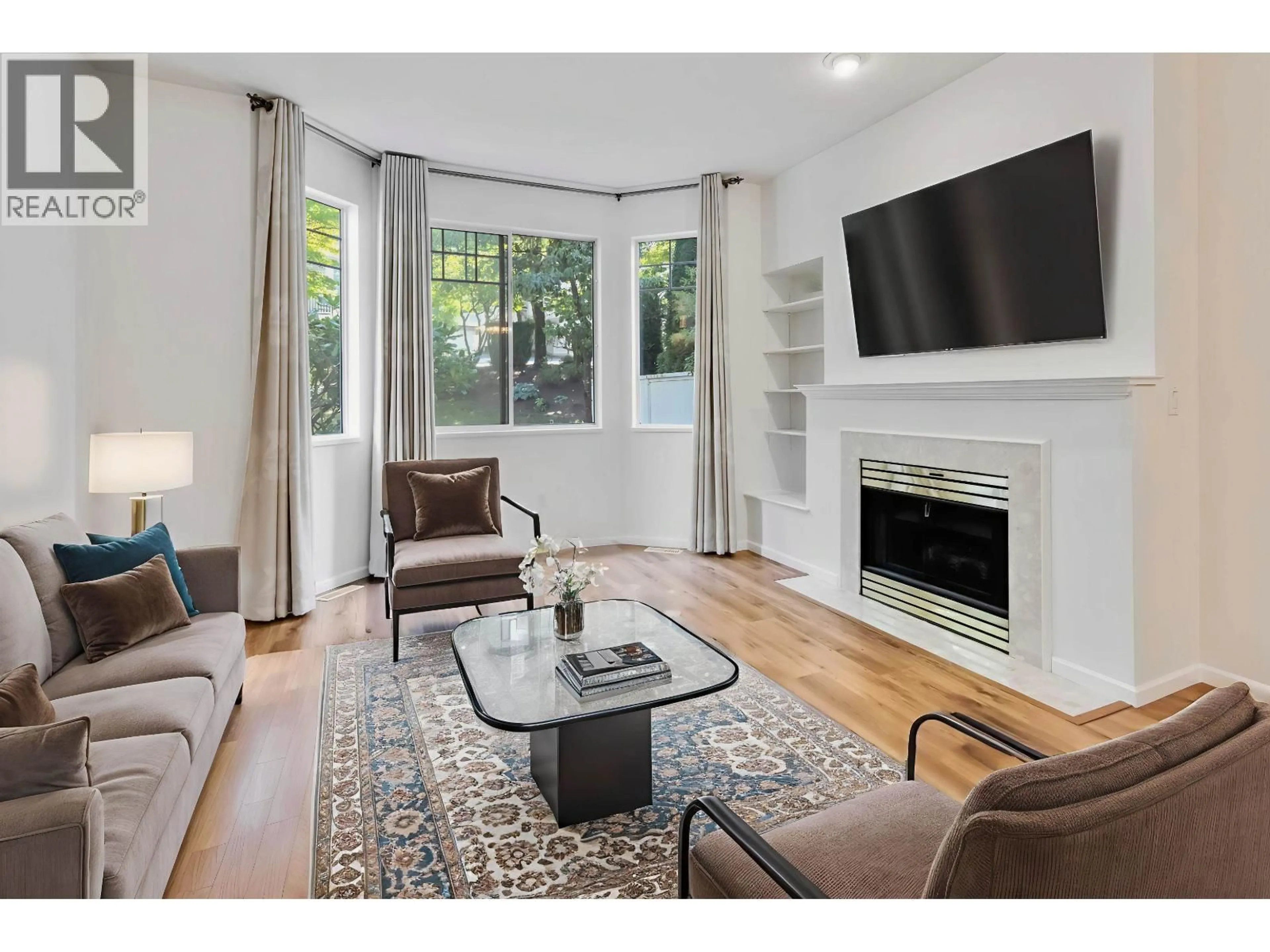 Living room with furniture, unknown for 103 - 7501 CUMBERLAND STREET, Burnaby British Columbia V3N4Y6