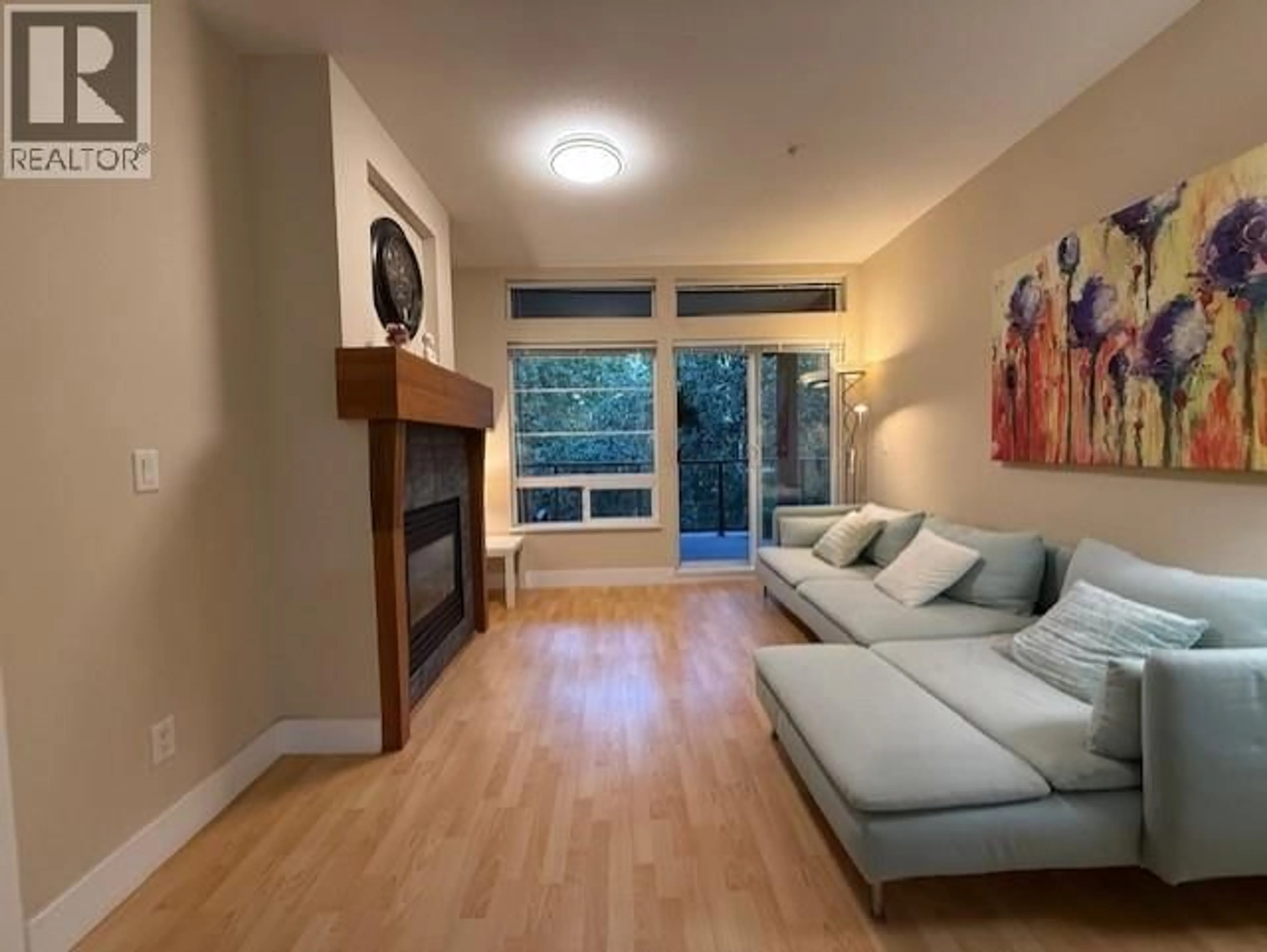 Living room with furniture, wood/laminate floor for 309 - 6328 LARKIN DRIVE, Vancouver British Columbia V6T2K2
