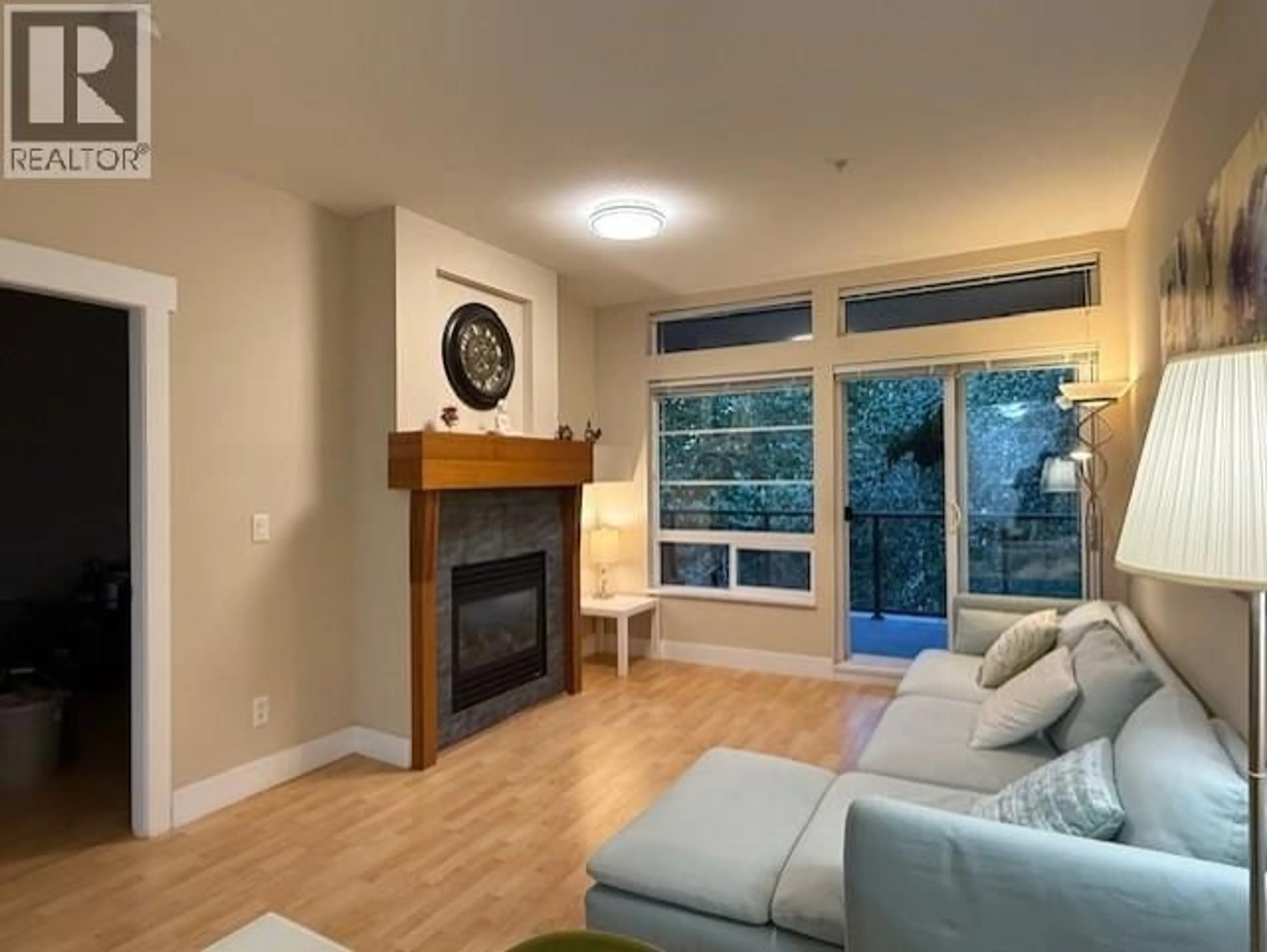 Living room with furniture, wood/laminate floor for 309 - 6328 LARKIN DRIVE, Vancouver British Columbia V6T2K2