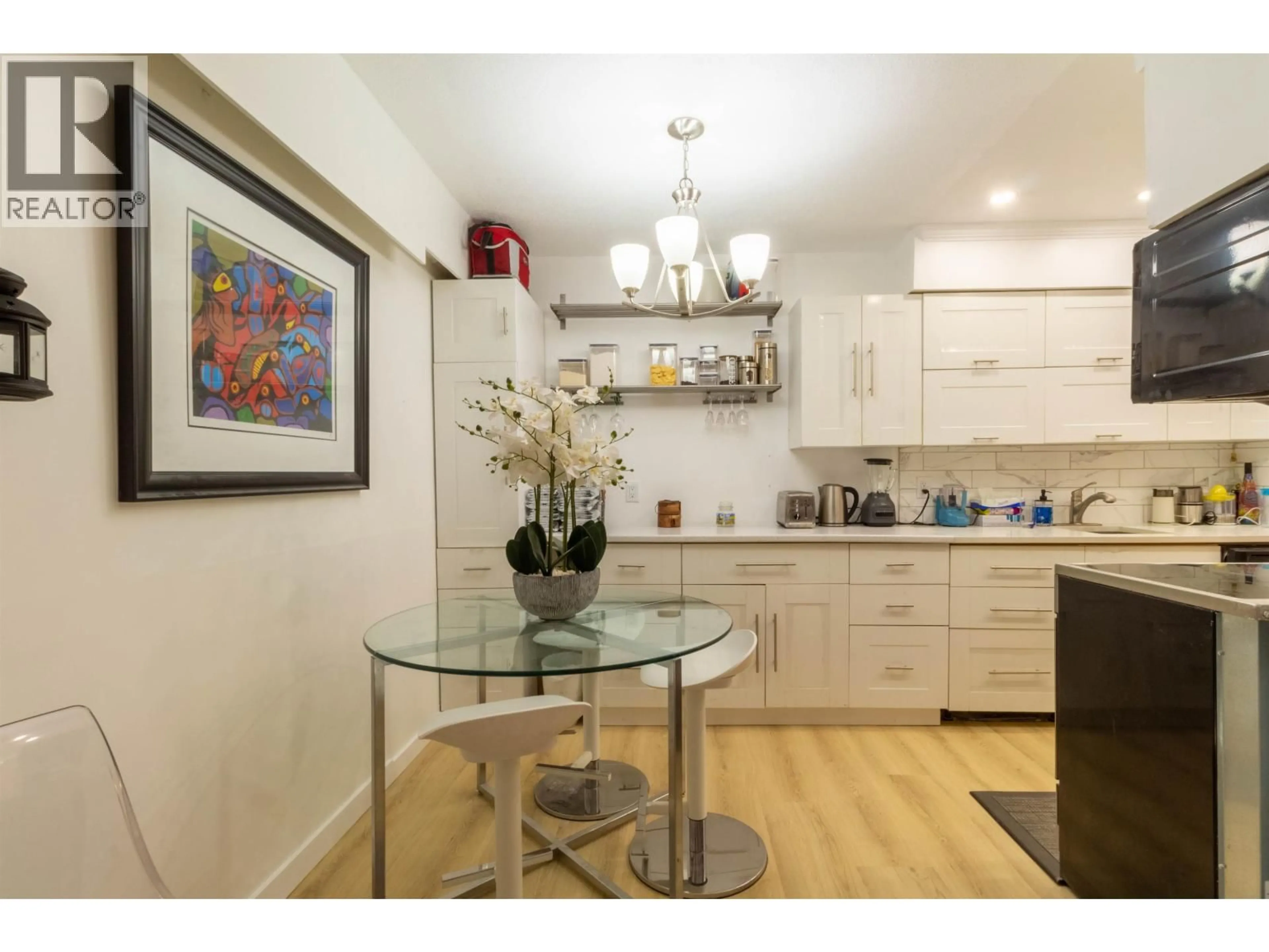 Open concept kitchen, wood/laminate floor for 106 - 7428 19TH AVENUE, Burnaby British Columbia V3N1E1
