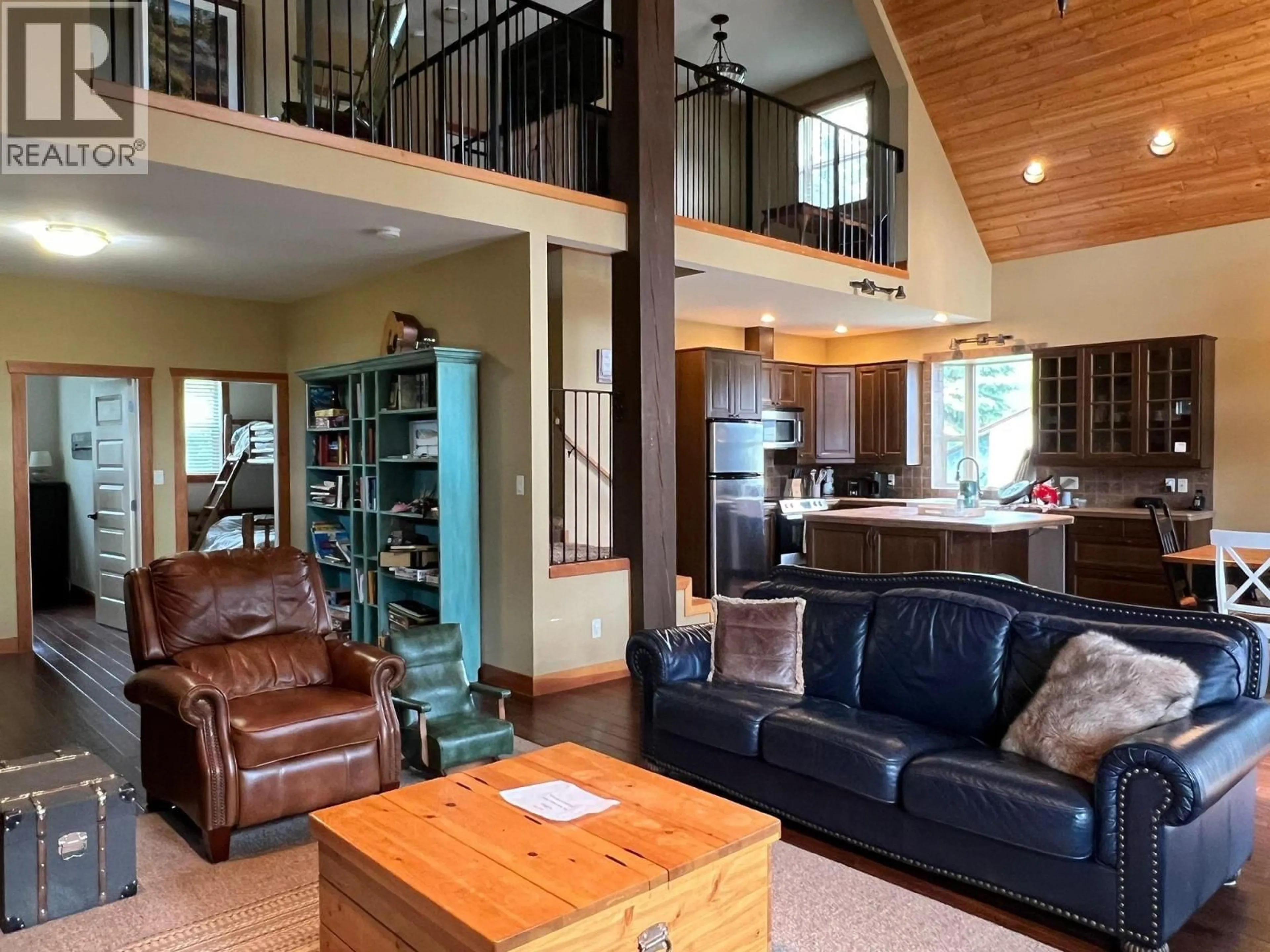 Living room with furniture, wood/laminate floor for 651 A ROAD, 100 Mile House British Columbia V0K1J0