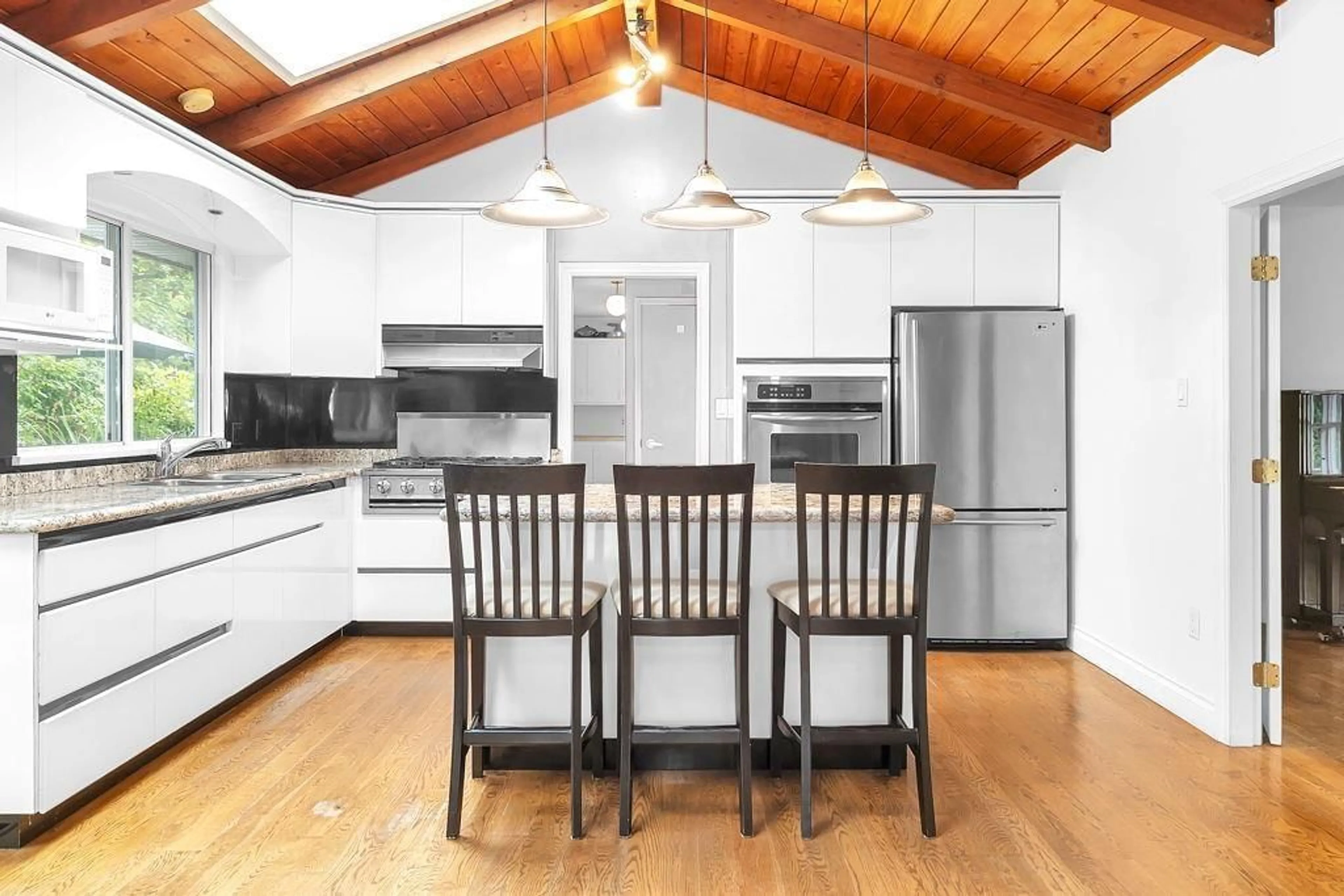 Open concept kitchen, wood/laminate floor for 5144 235, Langley British Columbia V2Z2P5
