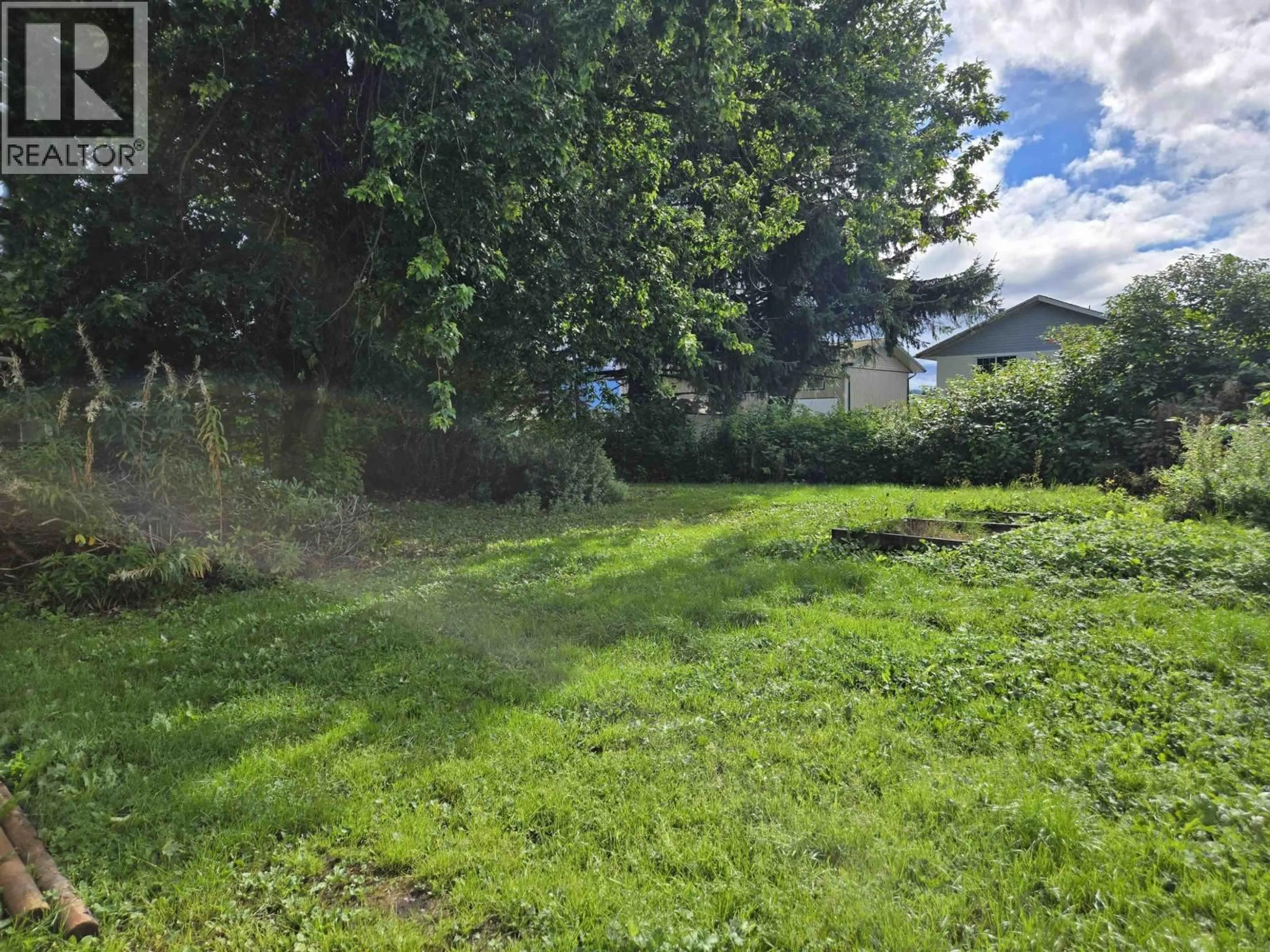 A pic from outside/outdoor area/front of a property/back of a property/a pic from drone, forest/trees view for 12 AMOS STREET, Kitimat British Columbia V8C1A6