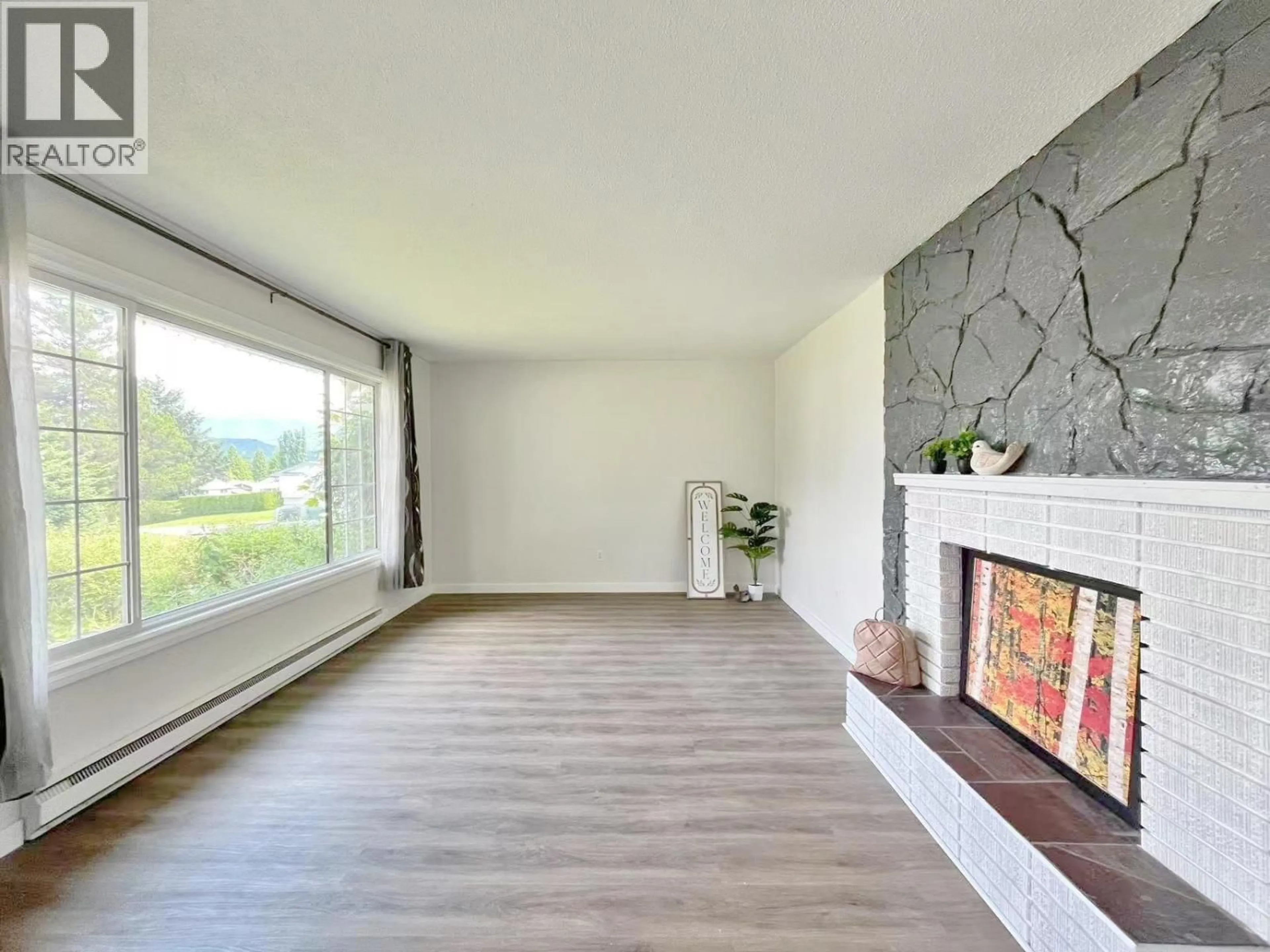 Living room with furniture, wood/laminate floor for 12 AMOS STREET, Kitimat British Columbia V8C1A6