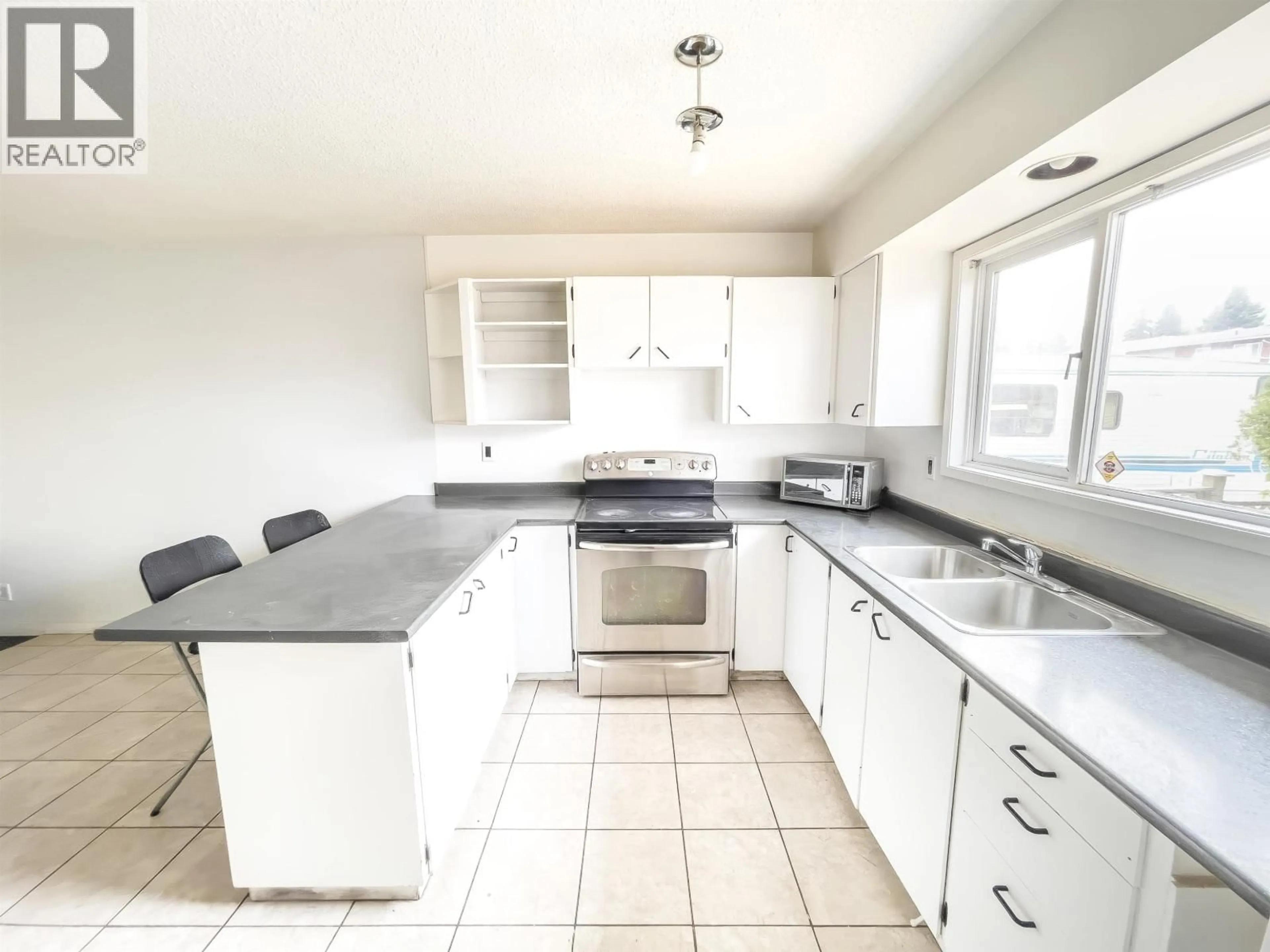Open concept kitchen, ceramic/tile floor for 544 BEECH CRESCENT, Prince George British Columbia V2L1L1