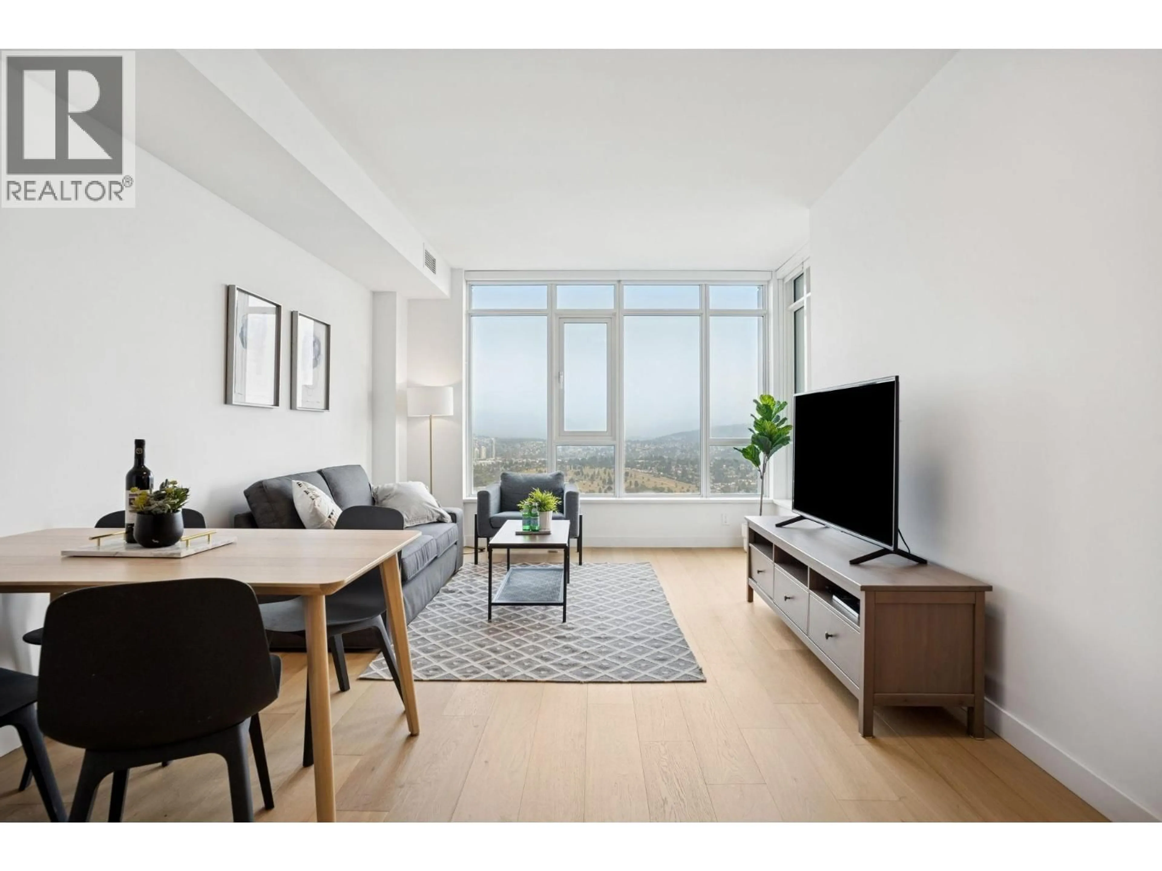 Living room with furniture, wood/laminate floor for 2409 - 4508 HAZEL STREET, Burnaby British Columbia V5H0E4