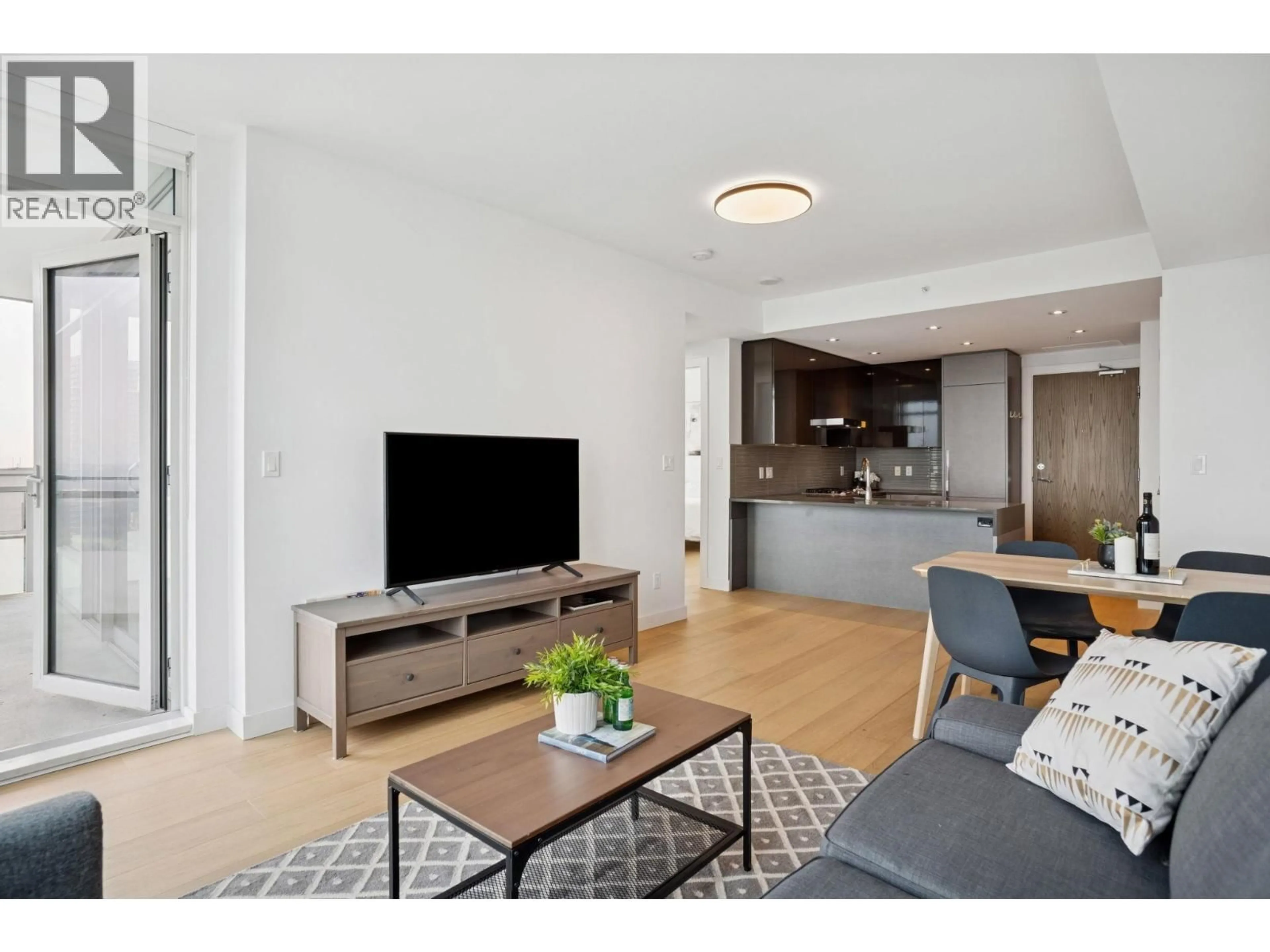 Living room with furniture, wood/laminate floor for 2409 - 4508 HAZEL STREET, Burnaby British Columbia V5H0E4