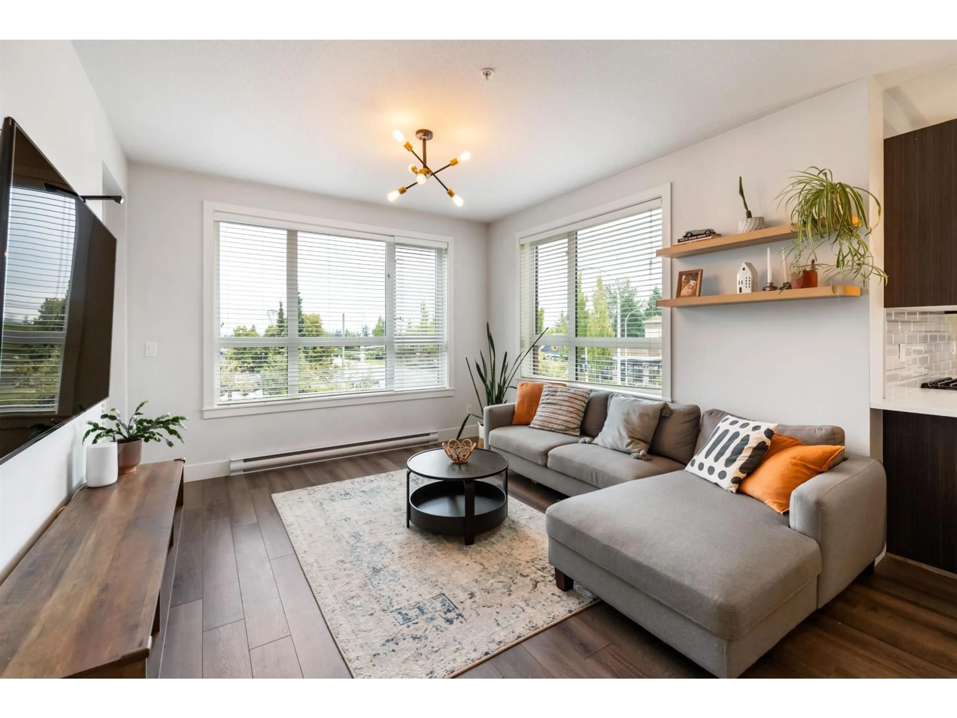 Living room with furniture, wood/laminate floor for 214 - 2960 151, Surrey British Columbia V4P0G3