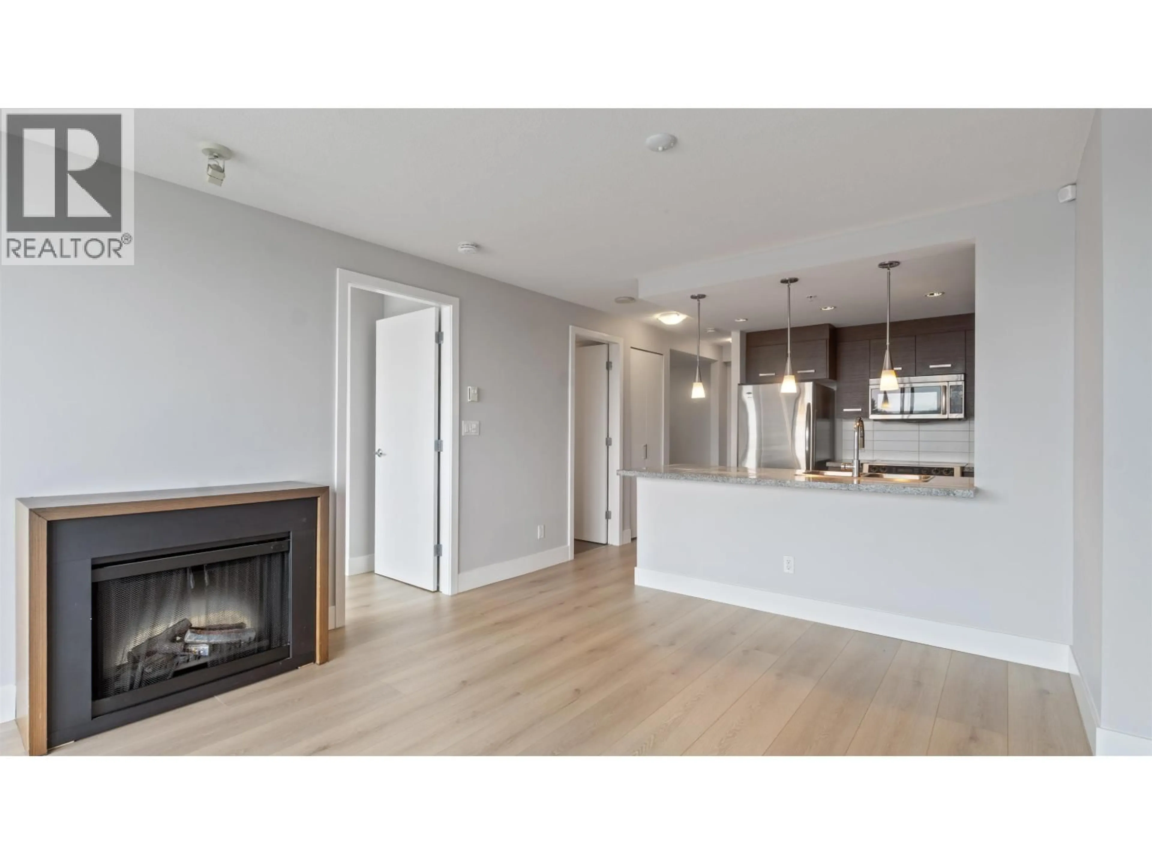 Open concept kitchen, wood/laminate floor for 806 - 2959 GLEN DRIVE, Coquitlam British Columbia V3B0B8