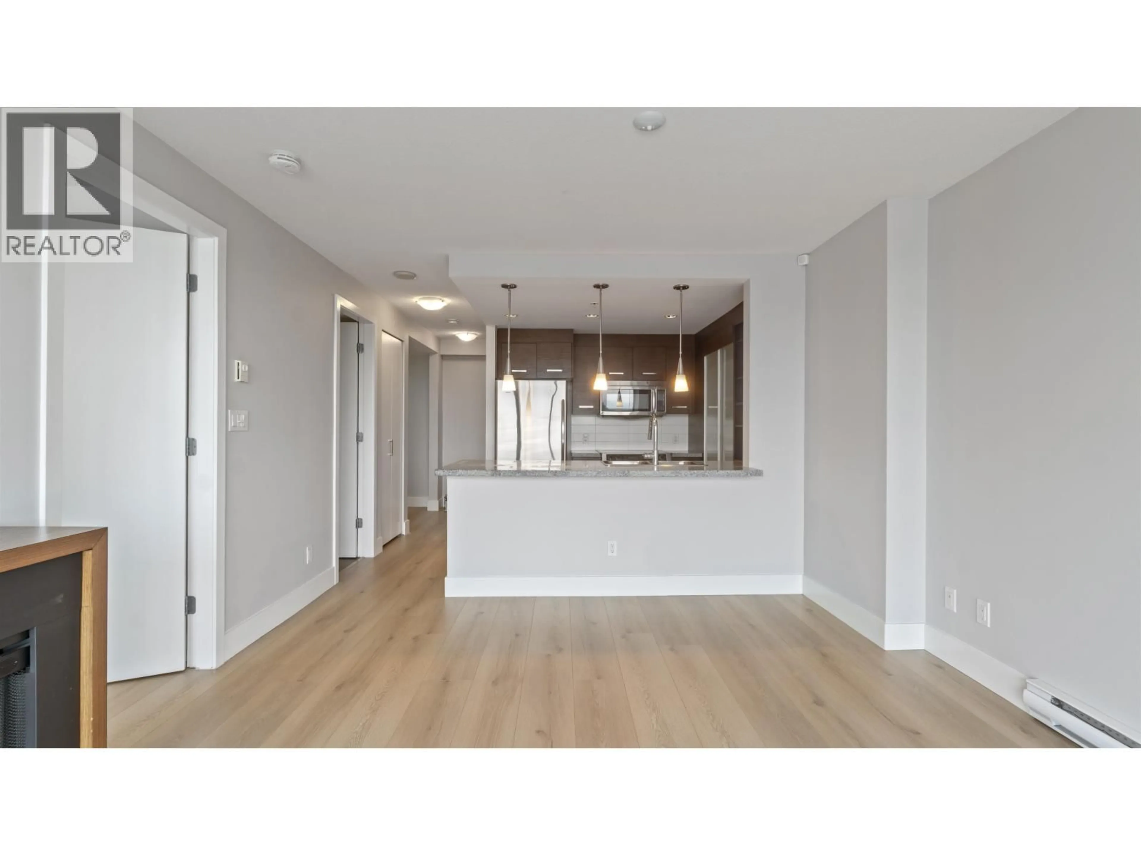Open concept kitchen, wood/laminate floor for 806 - 2959 GLEN DRIVE, Coquitlam British Columbia V3B0B8