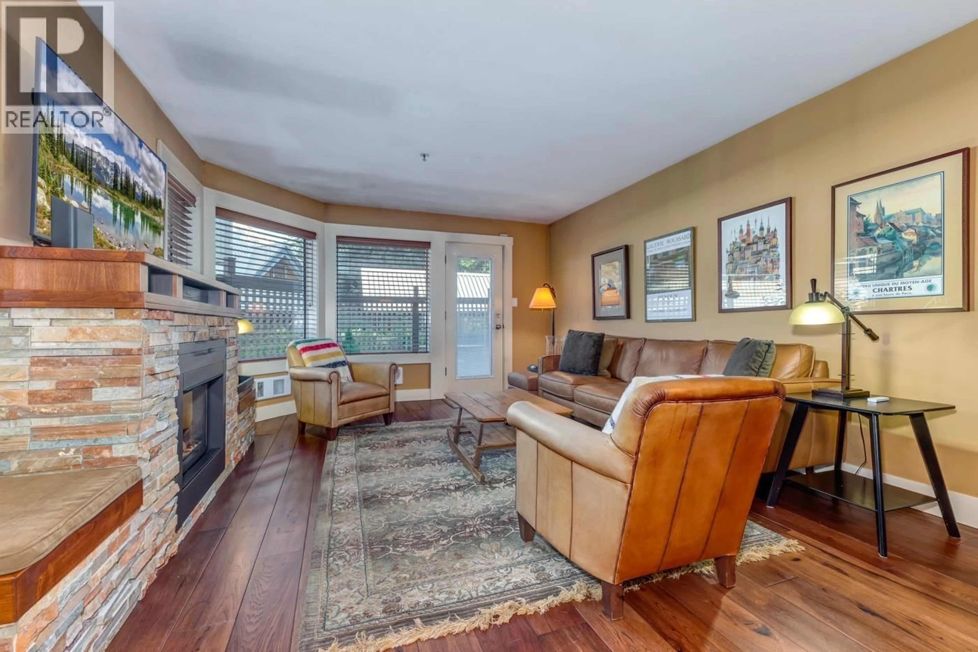 Living room with furniture, wood/laminate floor for 22 - 4857 PAINTED CLIFF ROAD, Whistler British Columbia V8E1C8