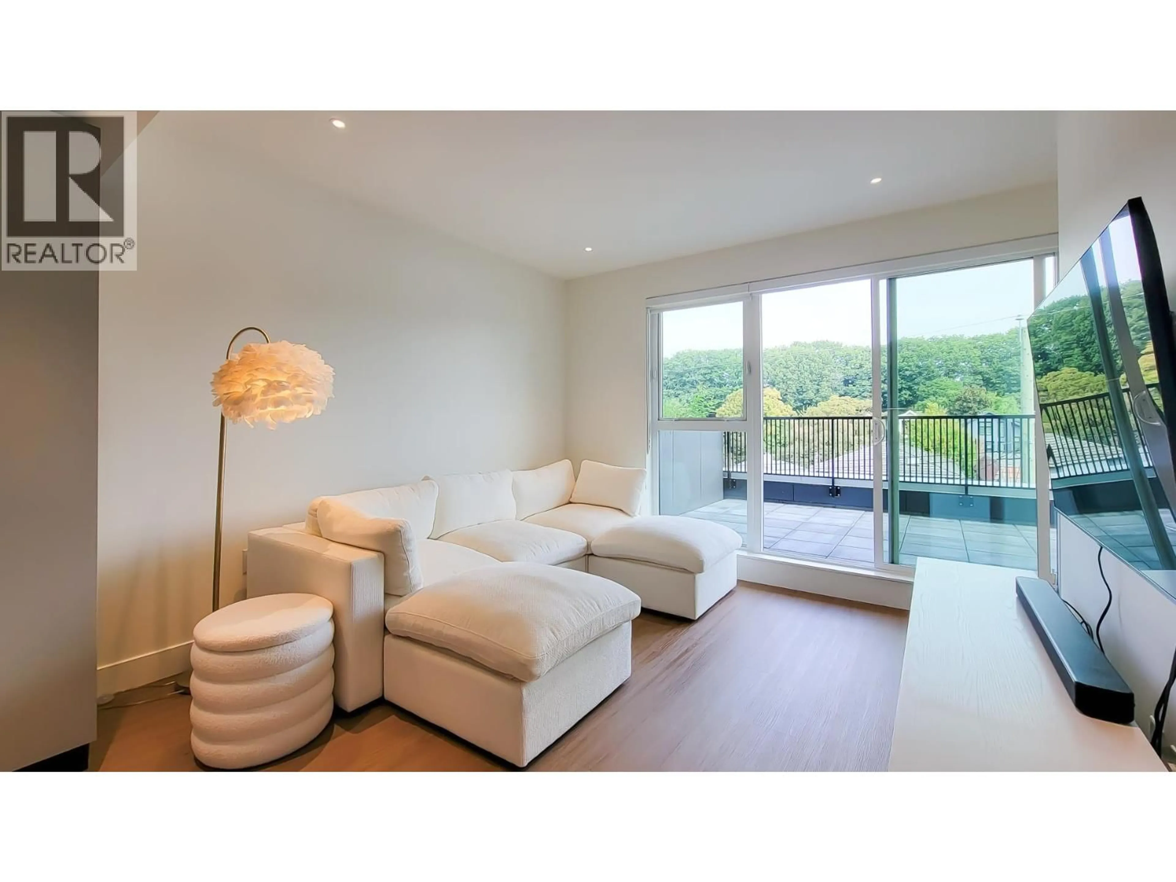Living room with furniture, wood/laminate floor for 401 - 2235 BROADWAY, Vancouver British Columbia V5N0J5