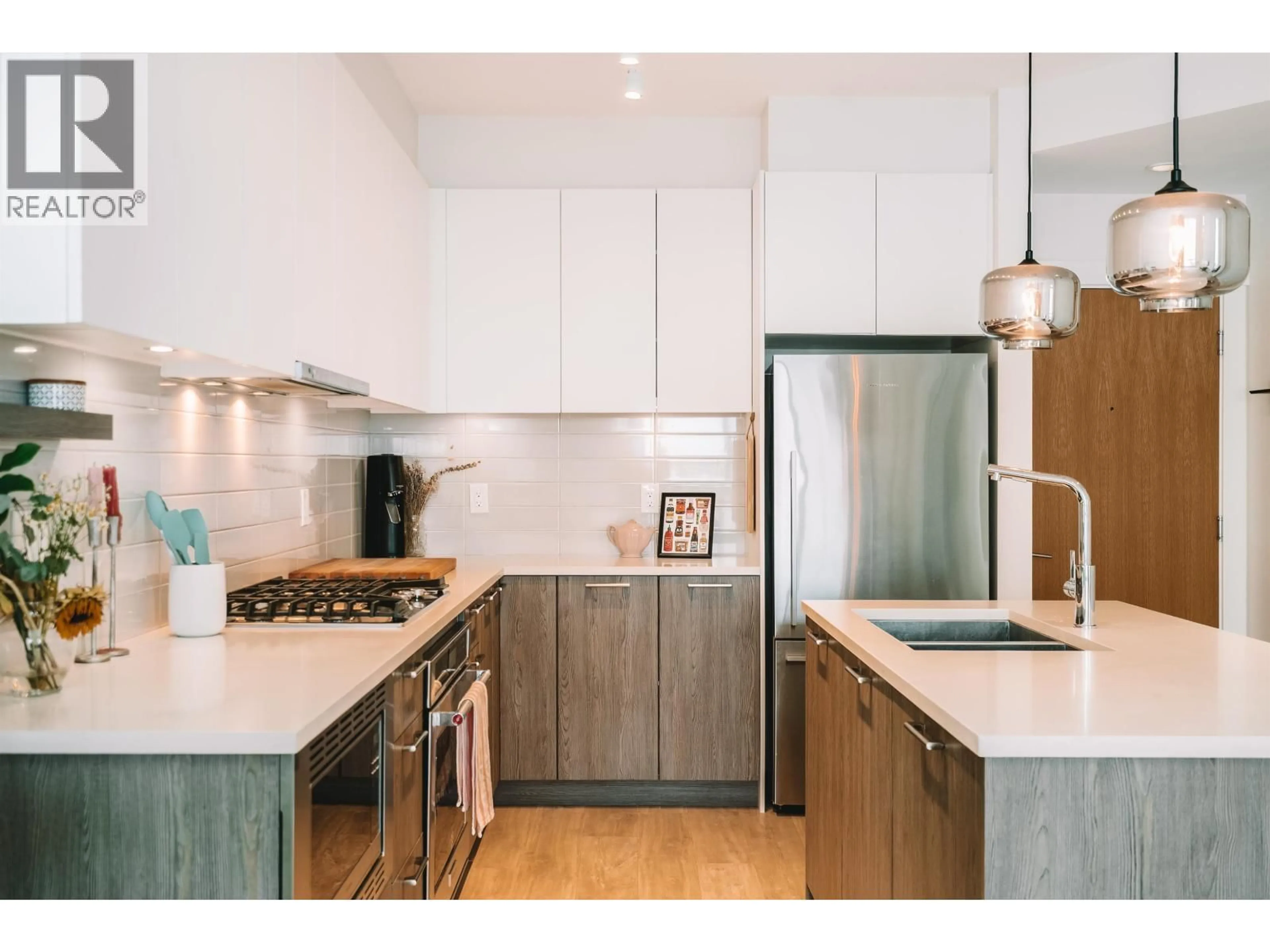 Contemporary kitchen, wood/laminate floor for 206 - 615 3RD STREET, North Vancouver British Columbia V7L0G3