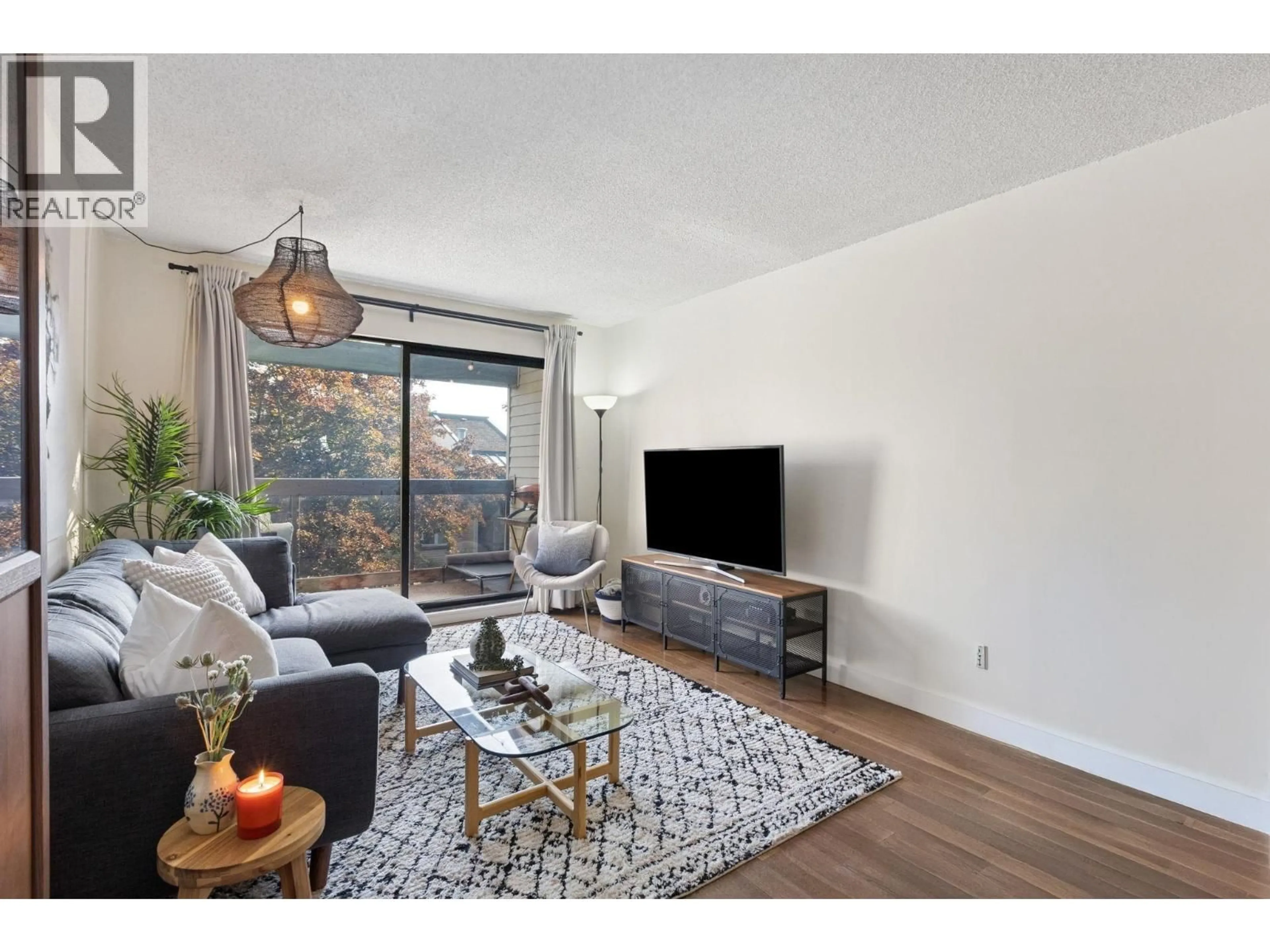 Living room with furniture, wood/laminate floor for 319 - 1422 3RD AVENUE, Vancouver British Columbia V5N5R5
