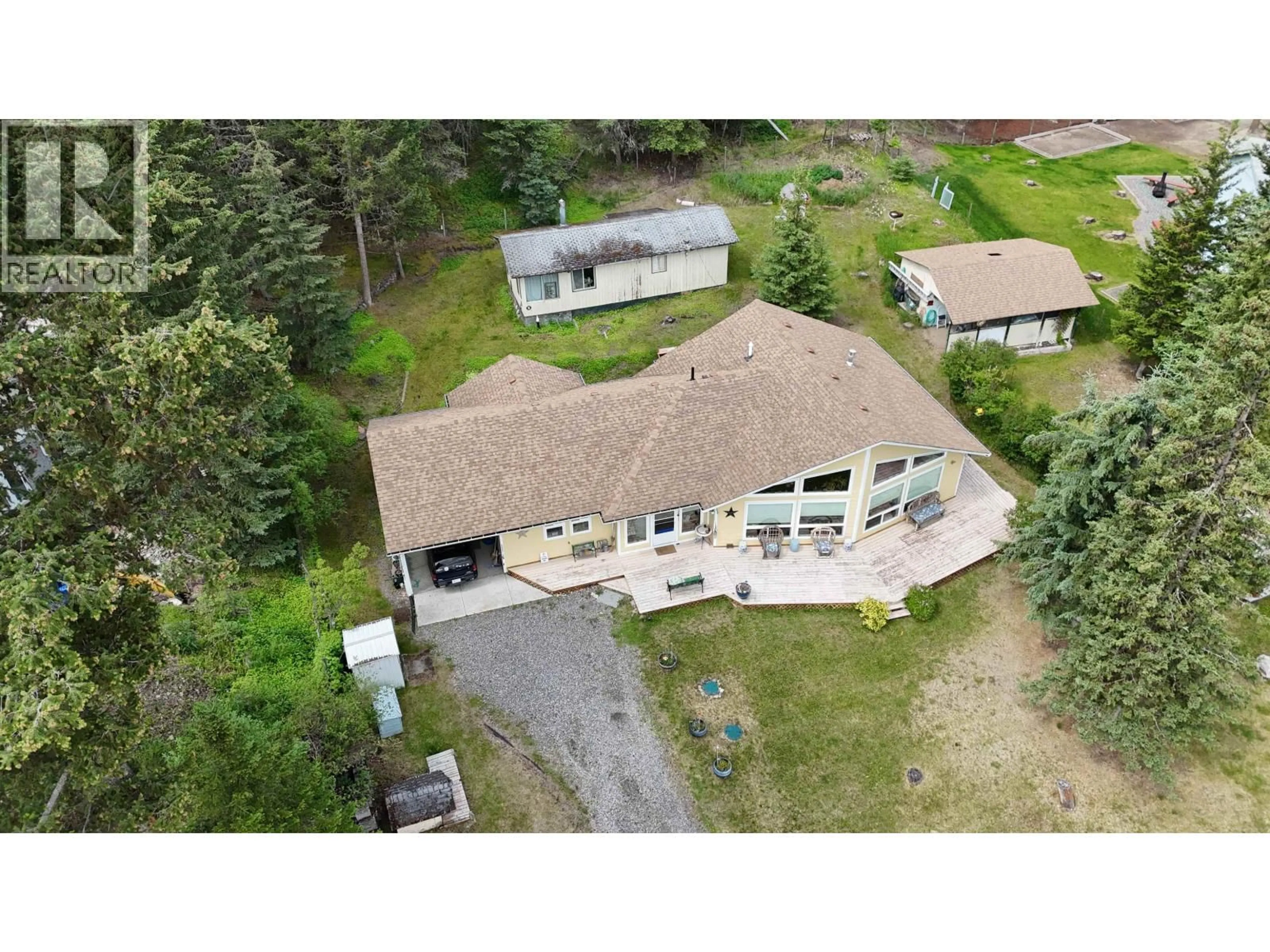 A pic from outside/outdoor area/front of a property/back of a property/a pic from drone, building for 5328 KALLUM DRIVE, 108 Mile Ranch British Columbia V0K2Z0